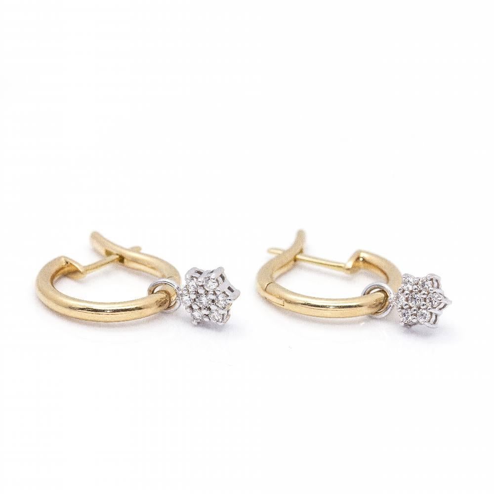 Bicolour Gold Earrings for women  These earrings allow you to remove the Diamond flower and wear them as earrings  14x Brilliant cut Diamonds with total weight approx. 0,18ct in H/VS quality  Catalan clasp  18kt Yellow Gold and White Gold  4,84