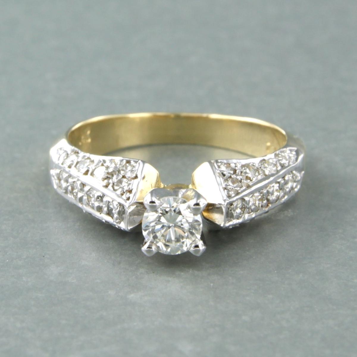 Bicolour Gold Diamond Ring - Ringsize US 6.0
14k bicolour gold ring set with brilliant cut diamond 0.30 carat G/H VS and 0.30 carat F/G VS/SI

The head of the ring is 0.5 cm wide
Ringsize US 6.0 / EU 16.75 (52)
Weight : 4.1 gram

Set