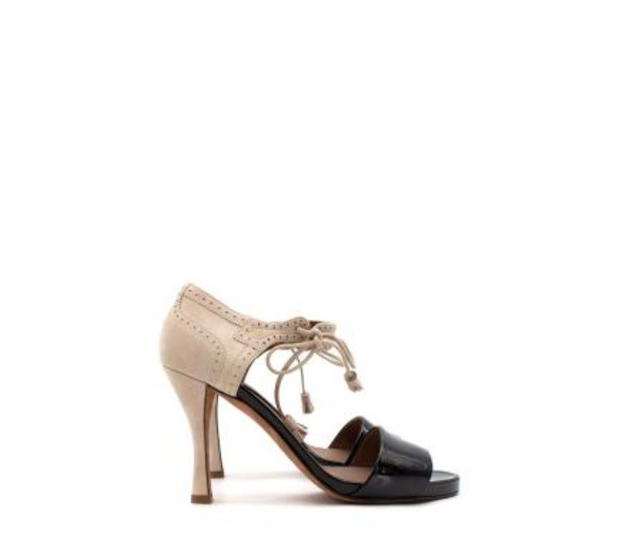 Hermes Bicolour suede & leather broguing heeled pumps
 

 - Bicolour heeled sandals featuring a black patent foot strap and toe bed, and stone suede ankle cuff with punched broguing details 
 - Self-tie ankle strap with tasselled ends 
 - Set on a