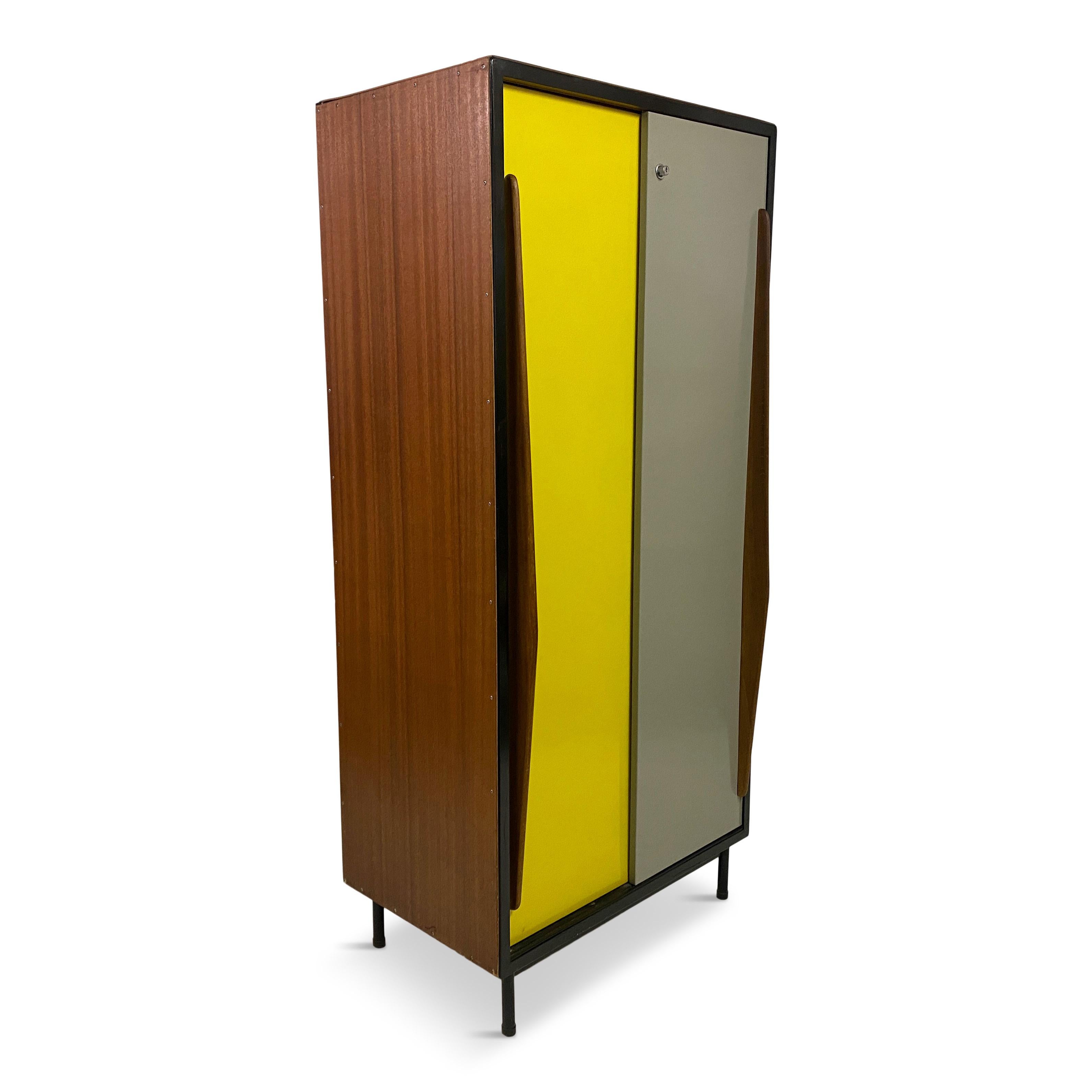 Cabinet or wardrobe 

By Willy Van der Meeren

For Tubax

Two sliding metal doors - yellow and grey

Wooden sides

Black metal frame

Tapering wooden handles

Hanging rail and shelves

Belgium 1950s

Another cabinet available 