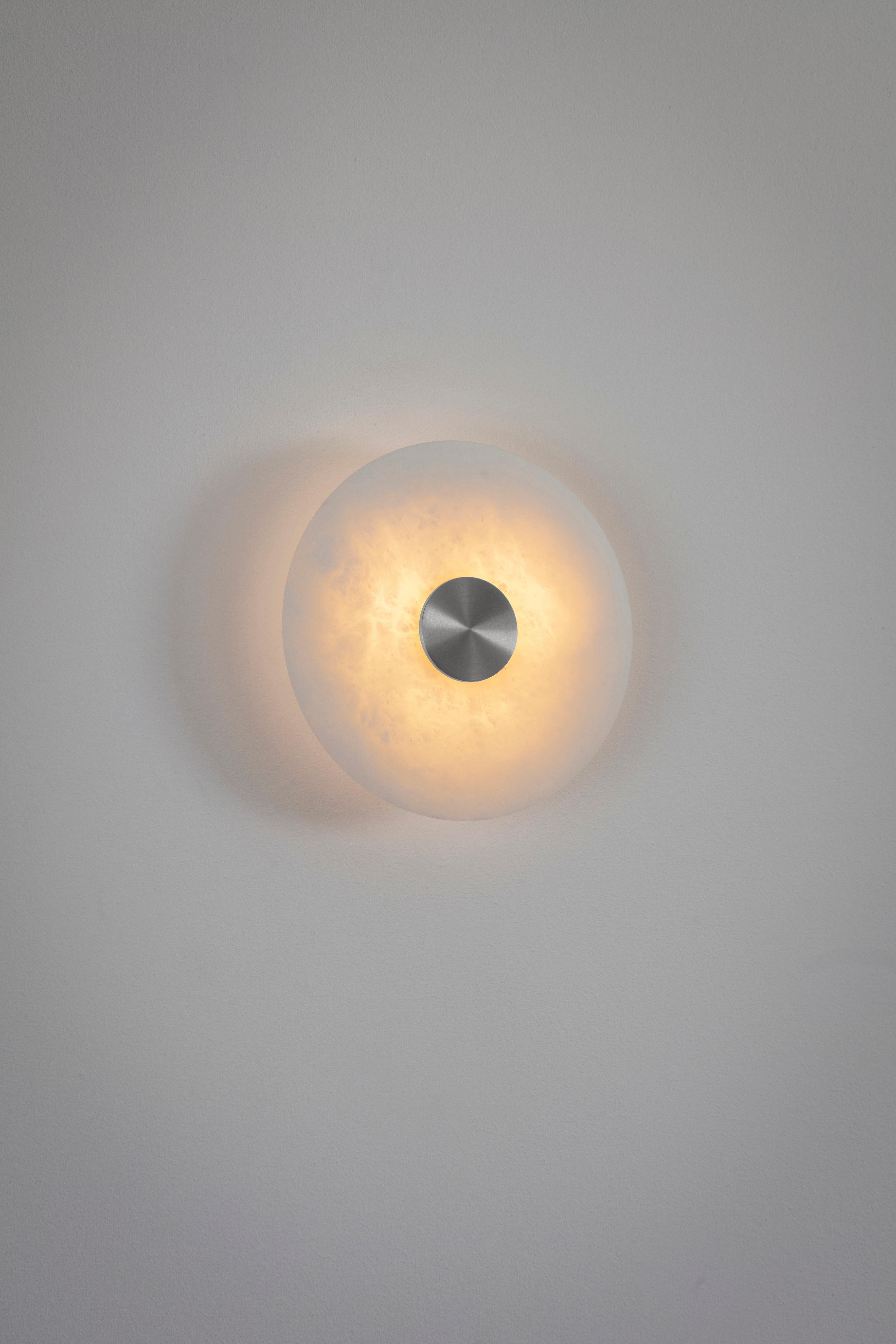 Bide small wall light nickel by Bert Frank
Dimensions: D 18 x H 6 cm
Materials: nickel, alabaster

All our lamps can be wired according to each country. If sold to the USA it will be wired for the USA for instance.

When Adam Yeats and Robbie