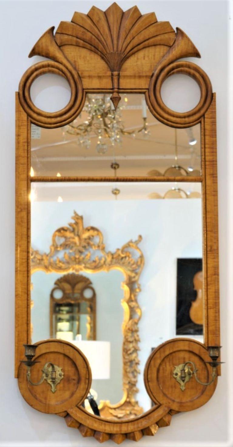 This stylish Biedermeire style mirror is a bespoke handcrafted masterpiece by Stepehn Becching from Tolland Connecticut for H. David Garrity. The piece is fabricated in a golden colored American tiger maple wood. 

Note: On the verso is a brass