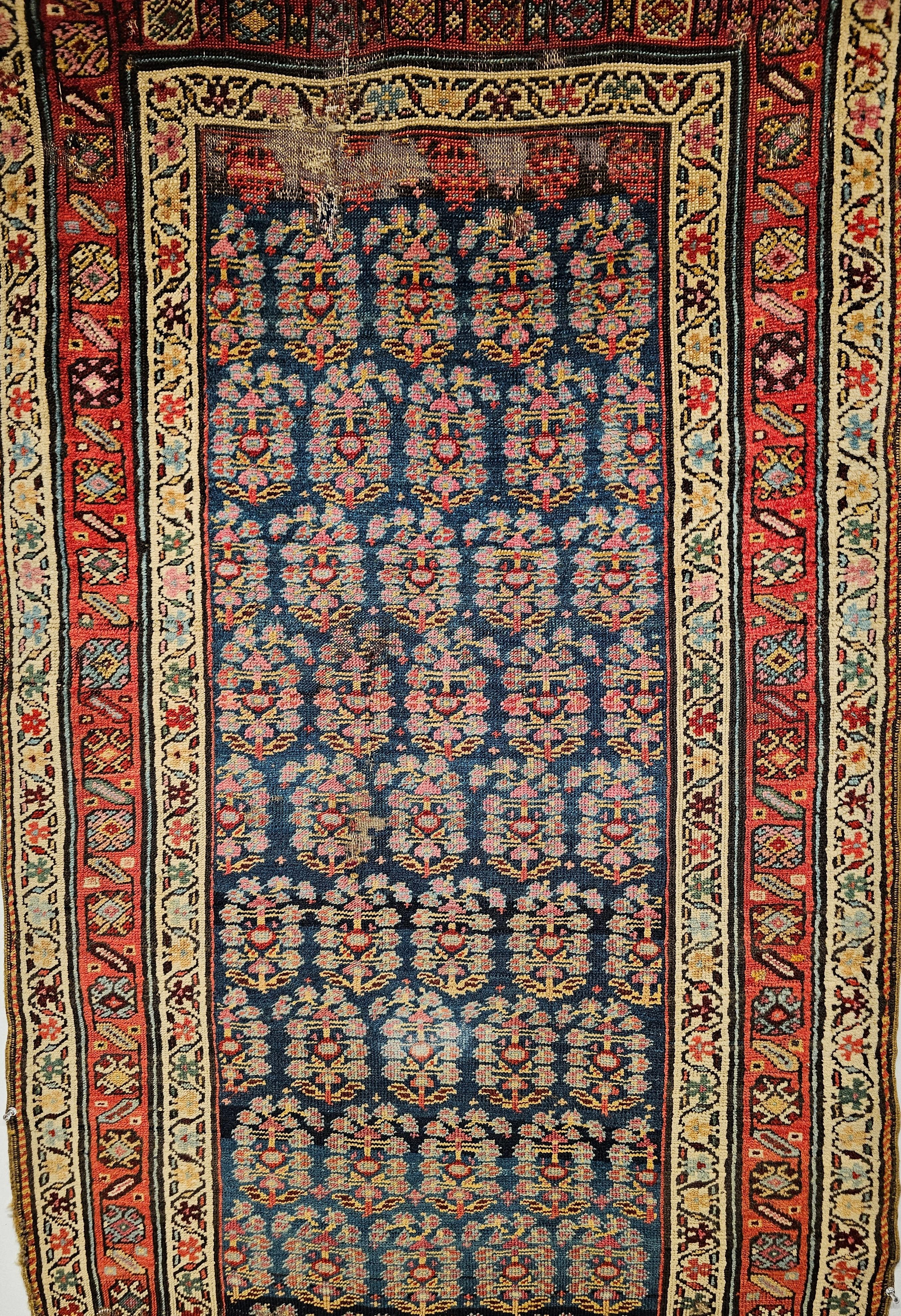 A 19th century hand woven Persian Bidjar runner has an allover pattern of  