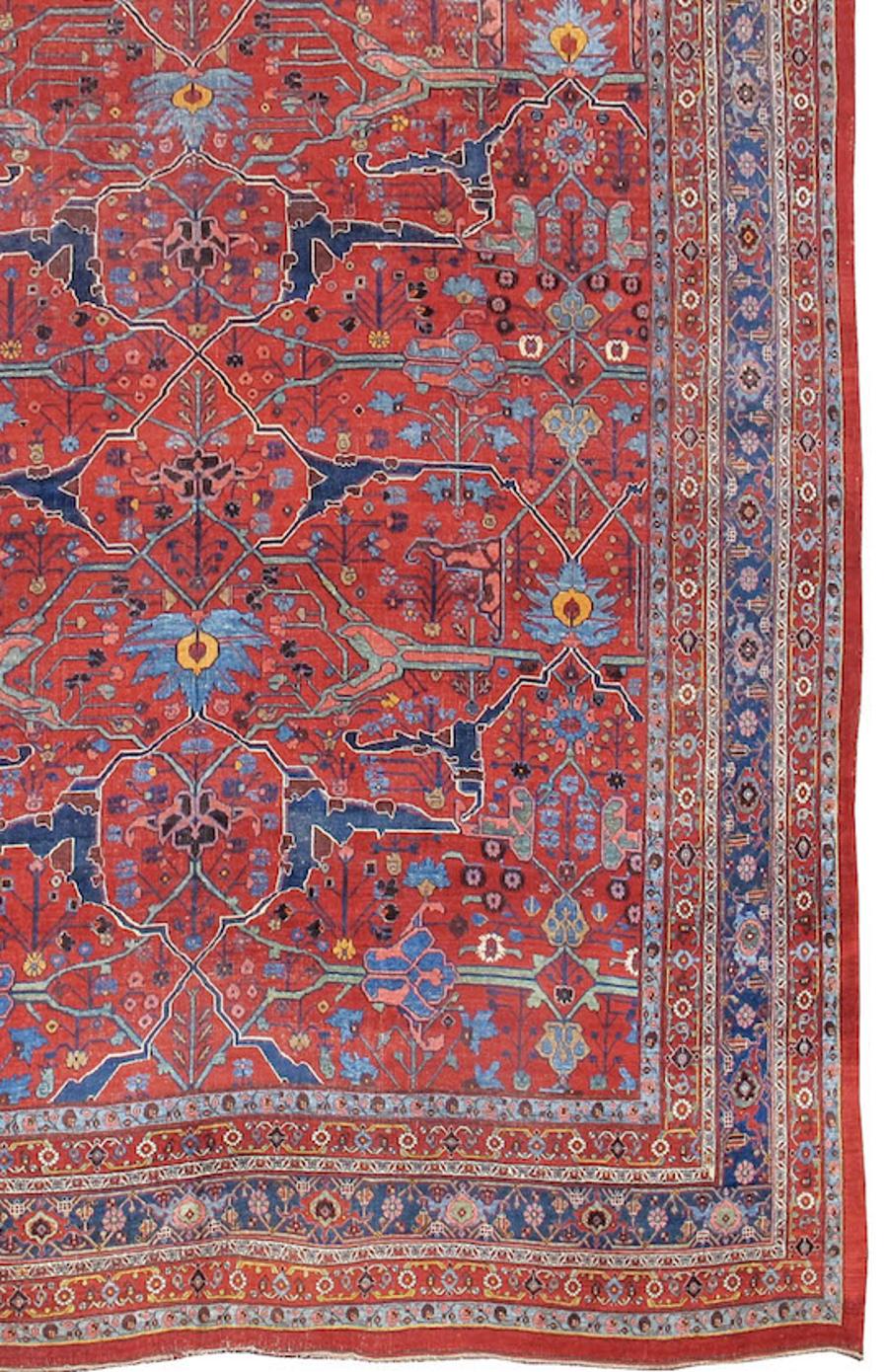 Large Oversized Antique Persian Bidjar Carpet, Late 19th Century

Finely drawn scrolls of vegetal ornamentation are traced against the saturated ruby-red ground of this fine Bidjar carpet. The delicacy of drawing is accented in no fewer than three