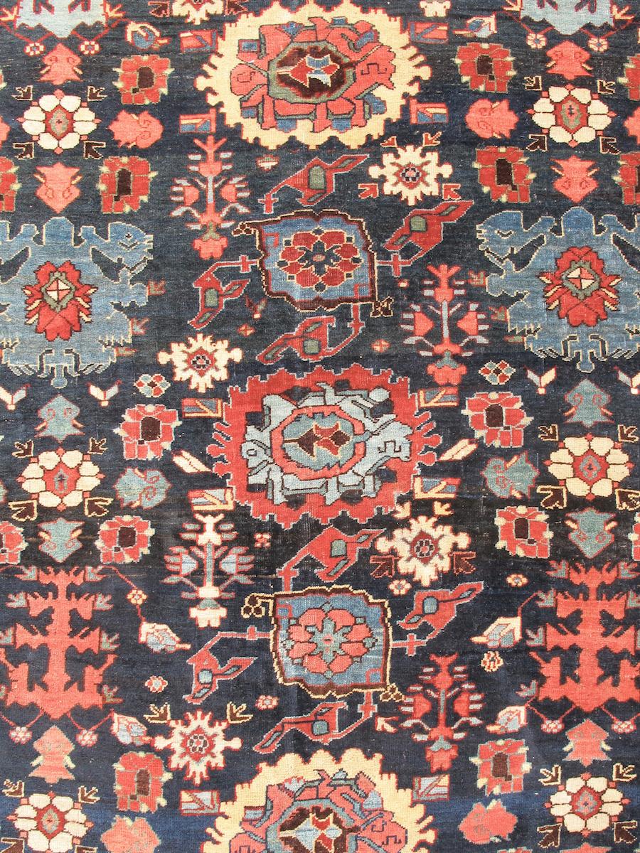 Bidjar carpets are known for their sturdy, depressed-warp weave packed full of wool pile. With this in mind, the supple and indeed pliable handle of this fine example is quite noteworthy. Using a classic Persian pattern of repeating palmettes known