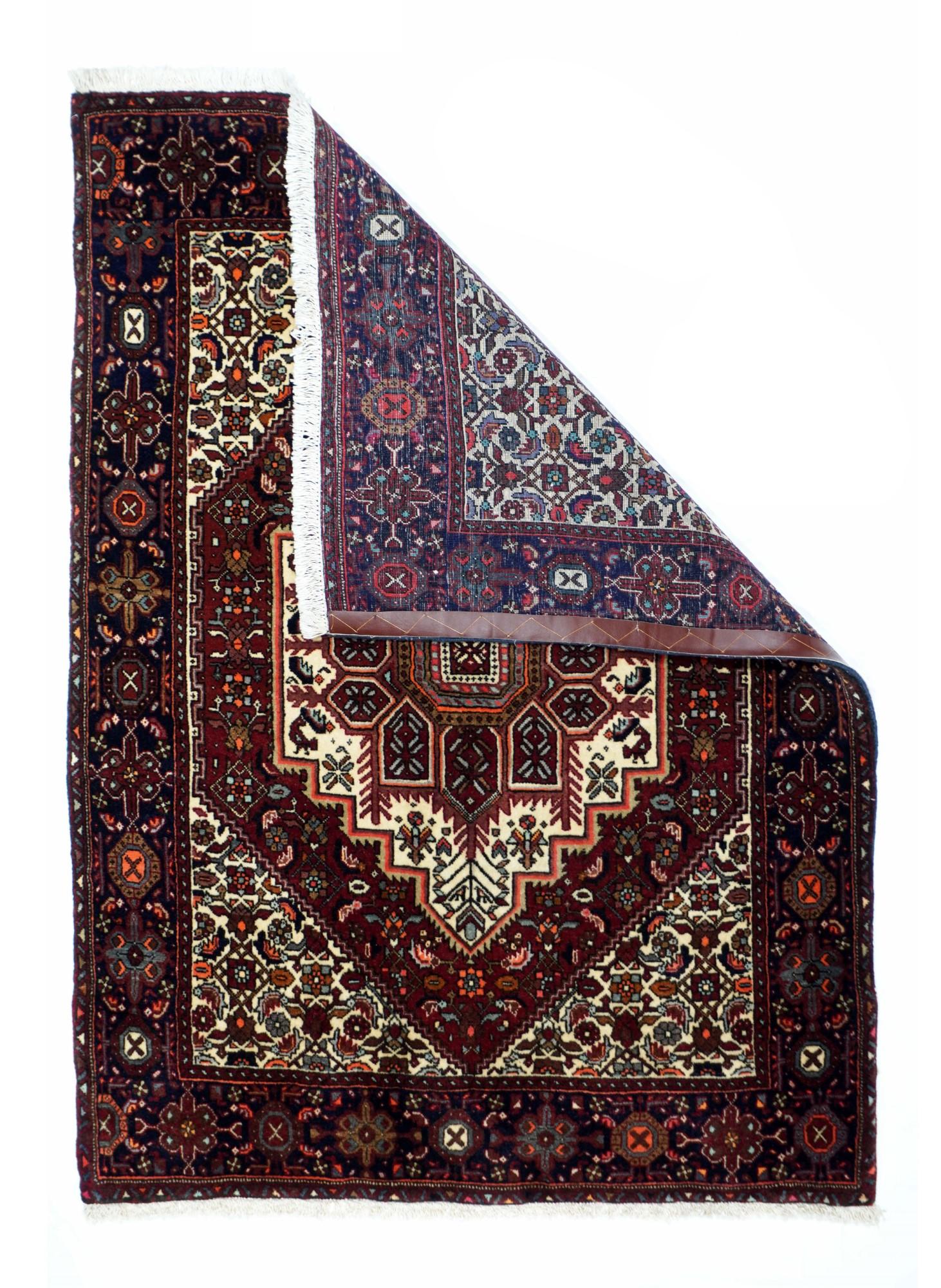Bidjar rug 3'5'' x 4'8''. This west Persian village scatter with the characteristic navy octofoil and cartouche border, is in the typical Heriz style with a dodecanal (12 lobe) palmette sub-medallion, set on a conforming stepped ecru medallion with