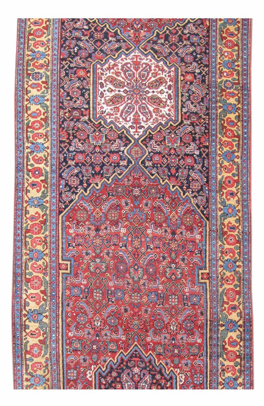 This elegant Bidjar runner balances the grandeur of a room size medallion carpet with the refinement of a more intimate piece. Runners present the weaver with a Challenge in their composition. Their narrow width limits the potential impact of field