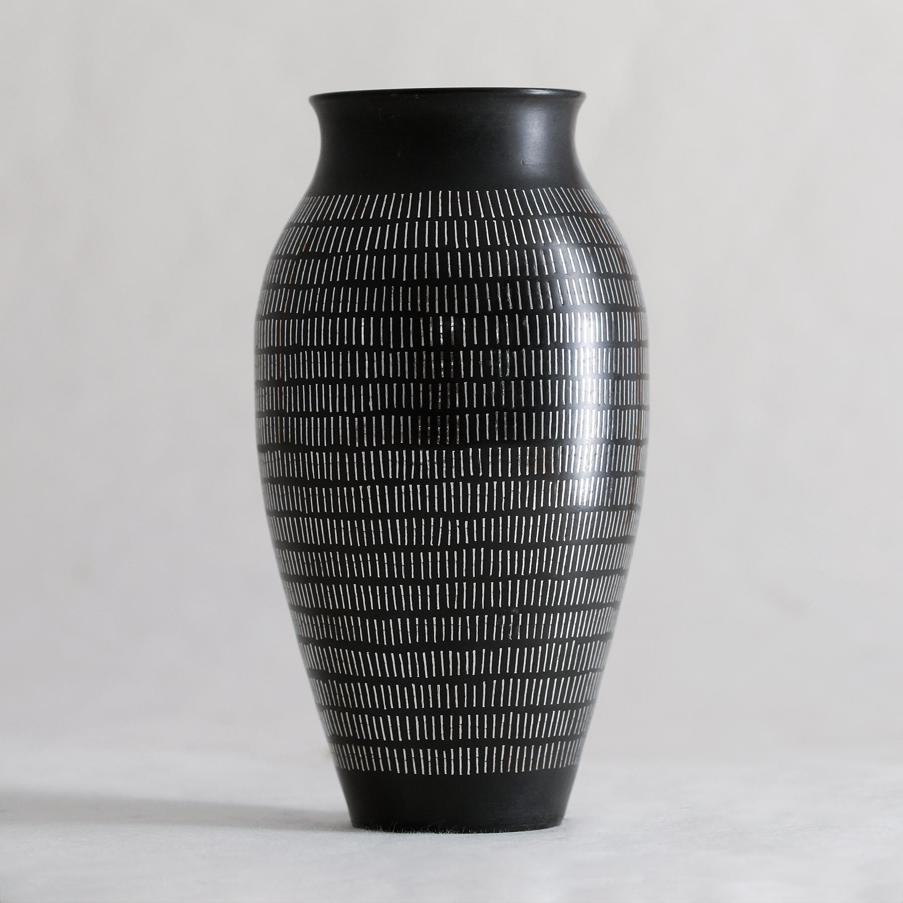 Inspired by moonlight on water, these vases are named after cities beside the Mediterranean Sea. Slender silver elements are fused onto the surface of cast vases to create beautifully flashes of light in the black metal.
