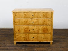 Biedermeier 19th Century Maple Wood Four-Drawer Chest with Inlaid Escutcheon
