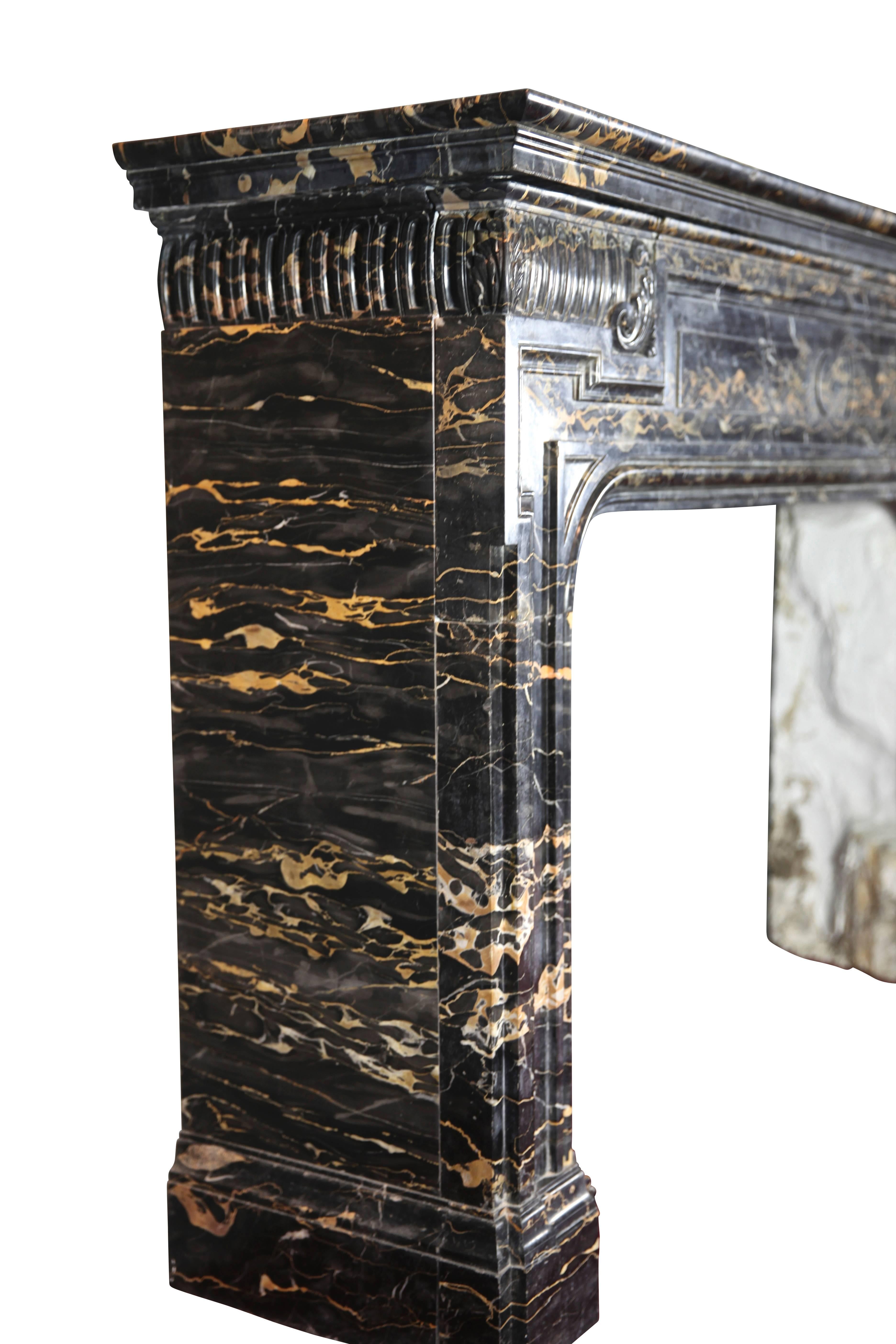 This unique and very high quality Biedermeier antique fireplace surround in Italian Porto d'or marble is one of a kind and bespoke. The marble is quite veined and was used in lot's of Historical landmarks, monuments such as New York Palace hotel, Le