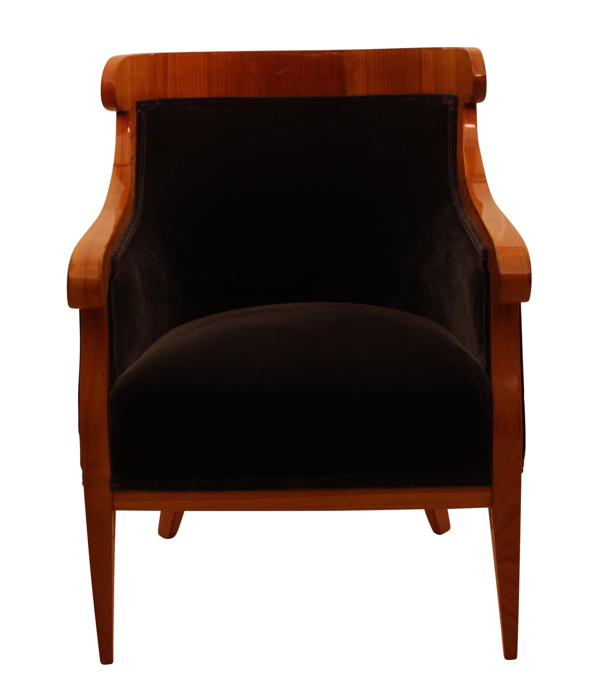 Wonderful and comfortable Biedermeier Bergère Chairs / Armchair from Austria/Vienna around 1830.

Very elegant design with conical, curved 4-edged legs made of cherry solid wood.

Vertically standing cherry veneer at the back- and armrest. 