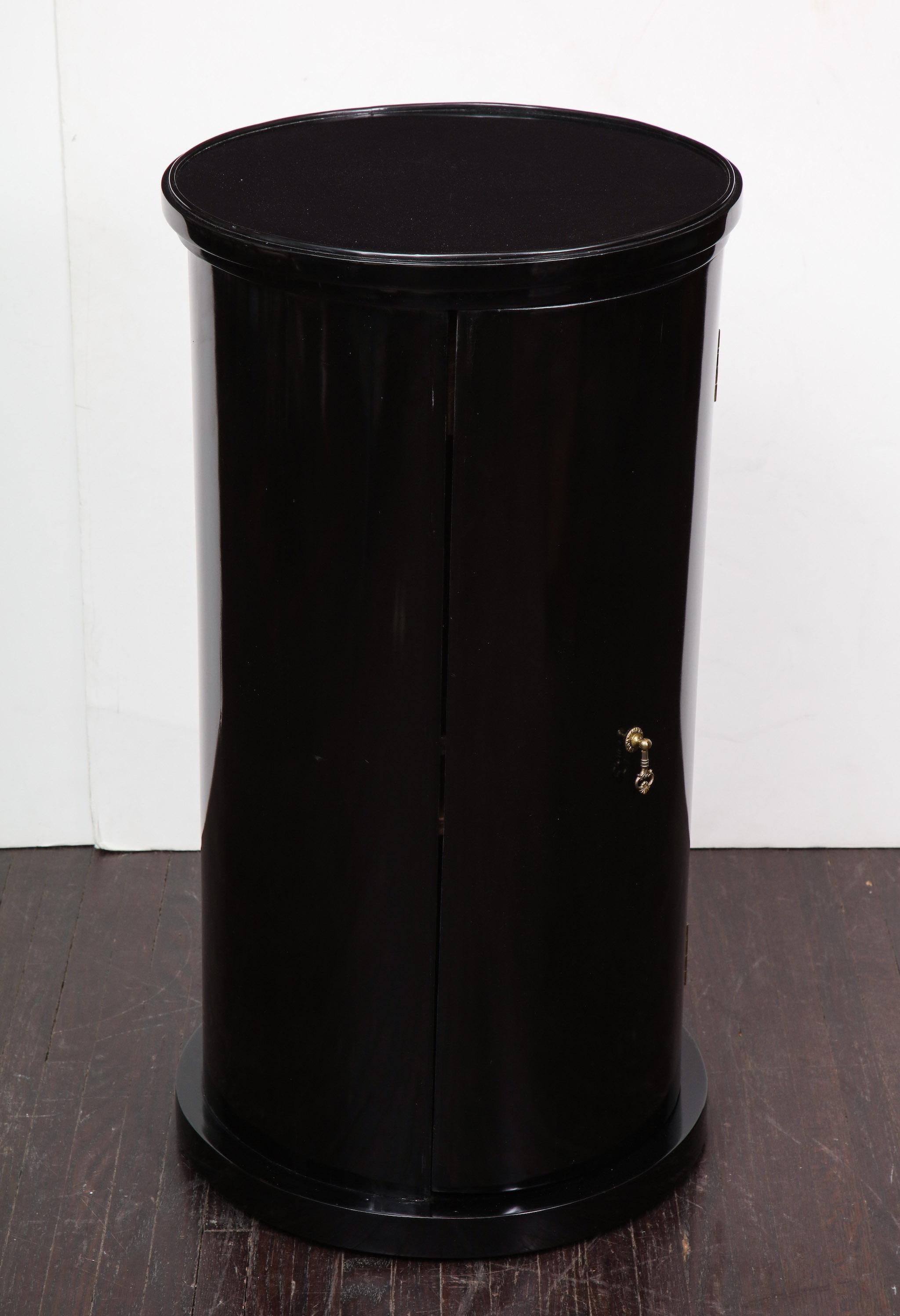 Biedermeier black lacquer drum cabinet. The piece is in good condition and shows some minor cosmetic wear that is consistent with age and use. Restoration quote can be provided upon request.