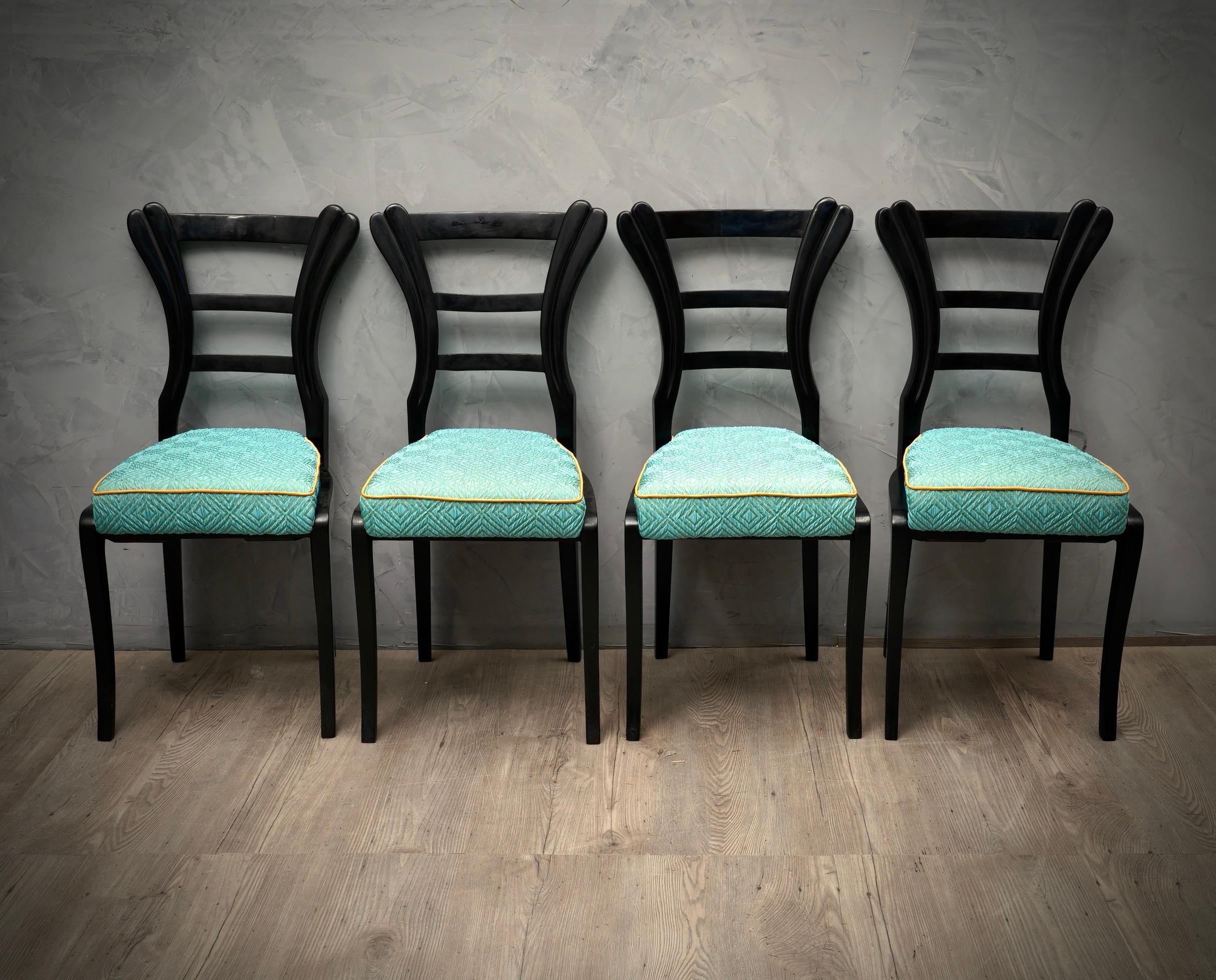 Four beautiful Biedermeier chairs with an unmistakable design, black shellac for the structure and a beautiful blue silk for the seat.

The chairs are polished in black shellac, have a very beautiful design, saber front legs and back with