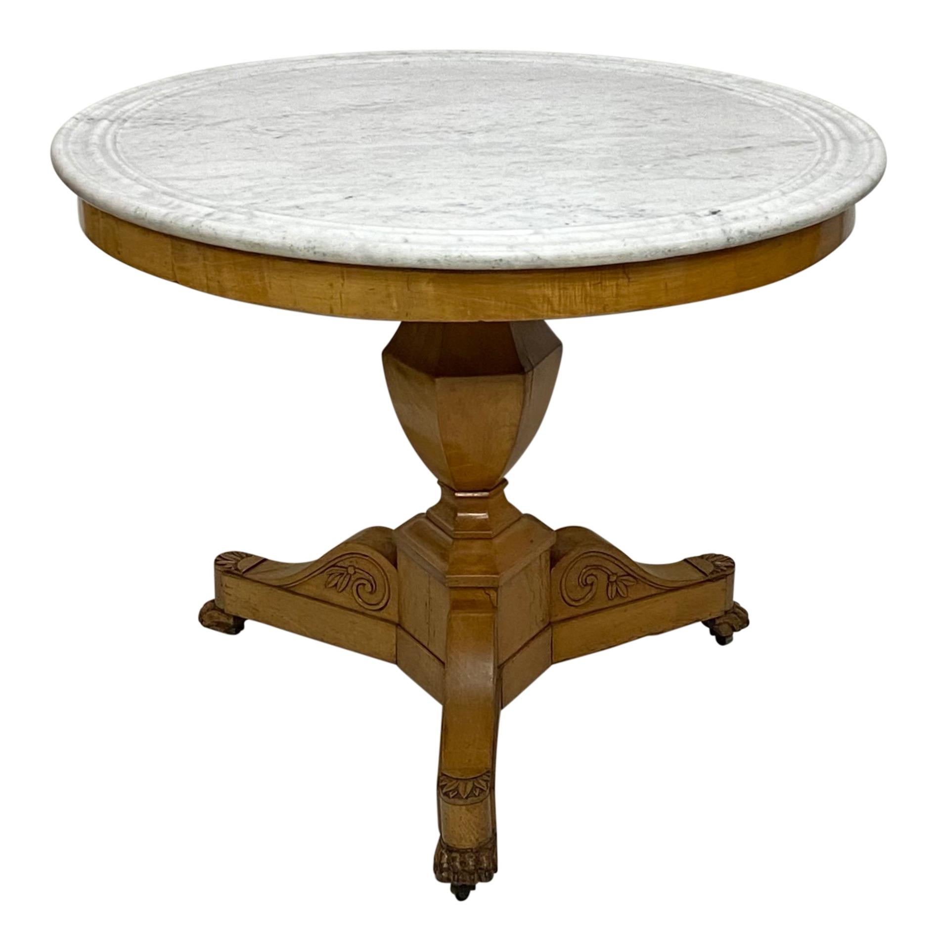 A high quality crafted Biedermeier style round maple center table with white marble top.
Original finish and marble, in lovely original antique condition.
1st quarter 19th century.
Northern European
Table shows expected light crazing to the
