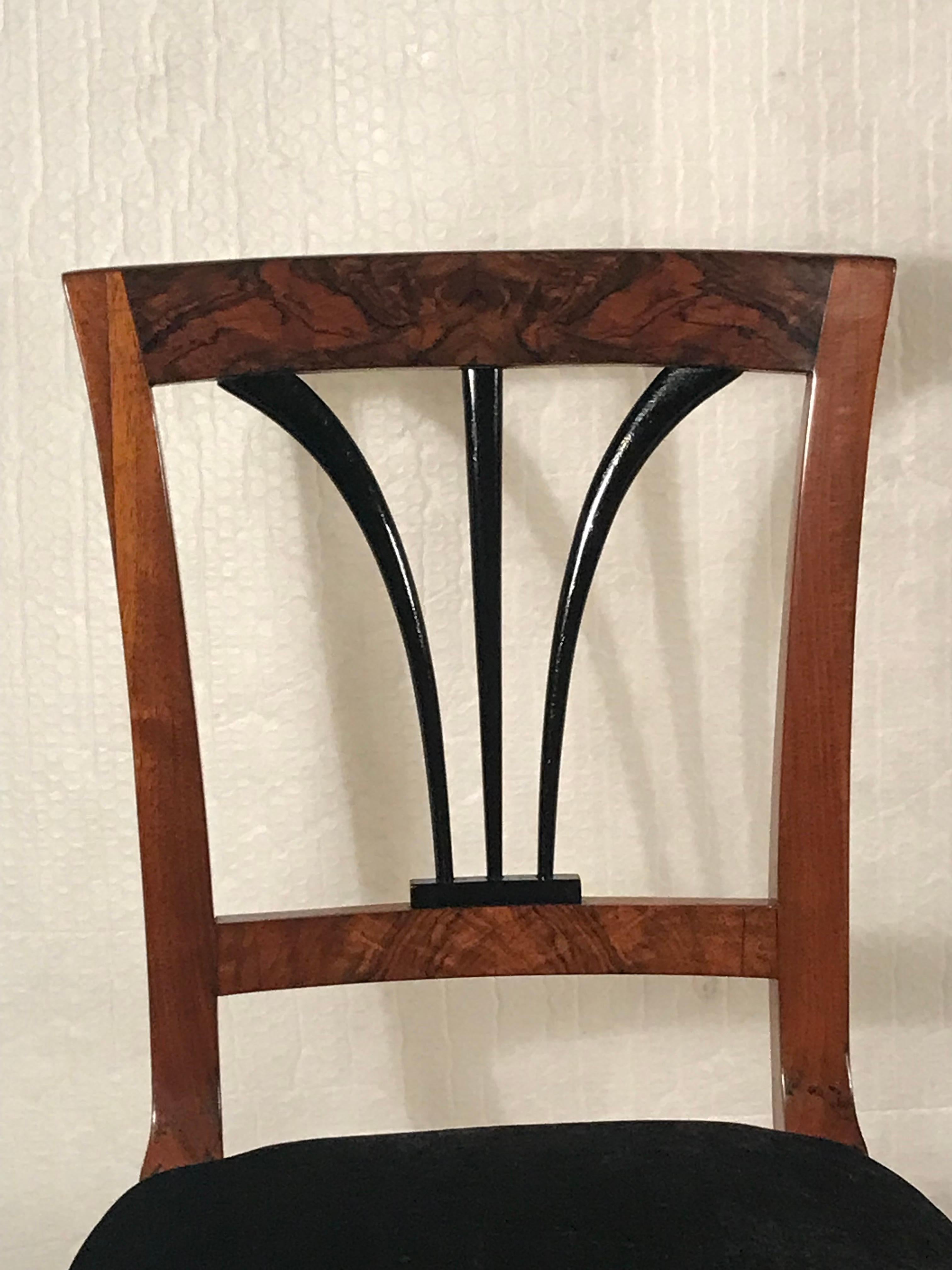 Discover a timeless piece of history with our classic Biedermeier chair from 1820s Southern Germany. Crafted with beautiful walnut veneer and showcasing an elegant ebonized back design.
Expertly refinished with a shellac hand polish and featuring