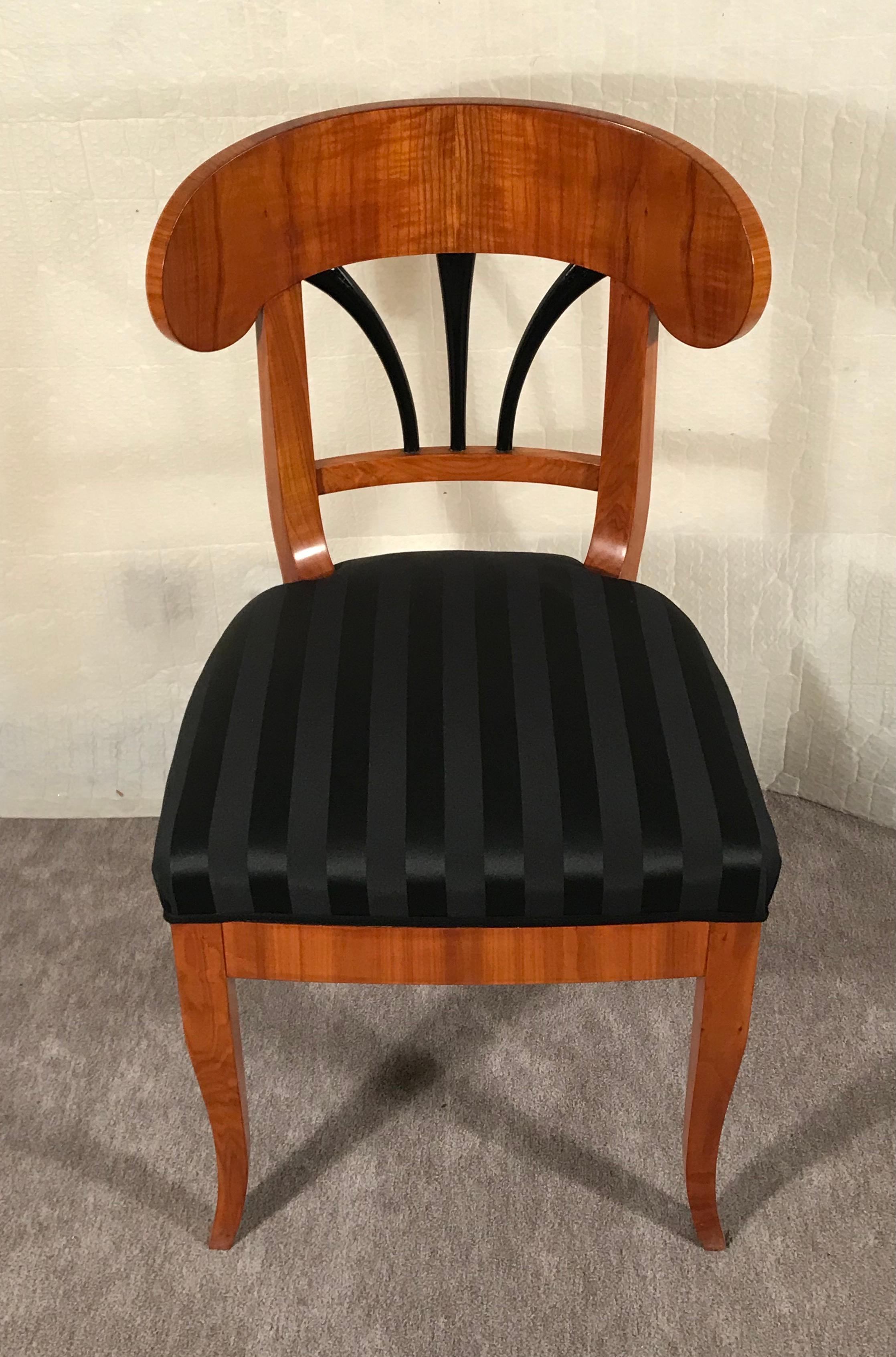 This unique Biedermeier chair dates back to 1820 and comes from Southern Germany. The pretty chair has a very nicely designed curved backrest with ebonized details. It has been expertly refinished, with a shellac hand polish. It comes with a new