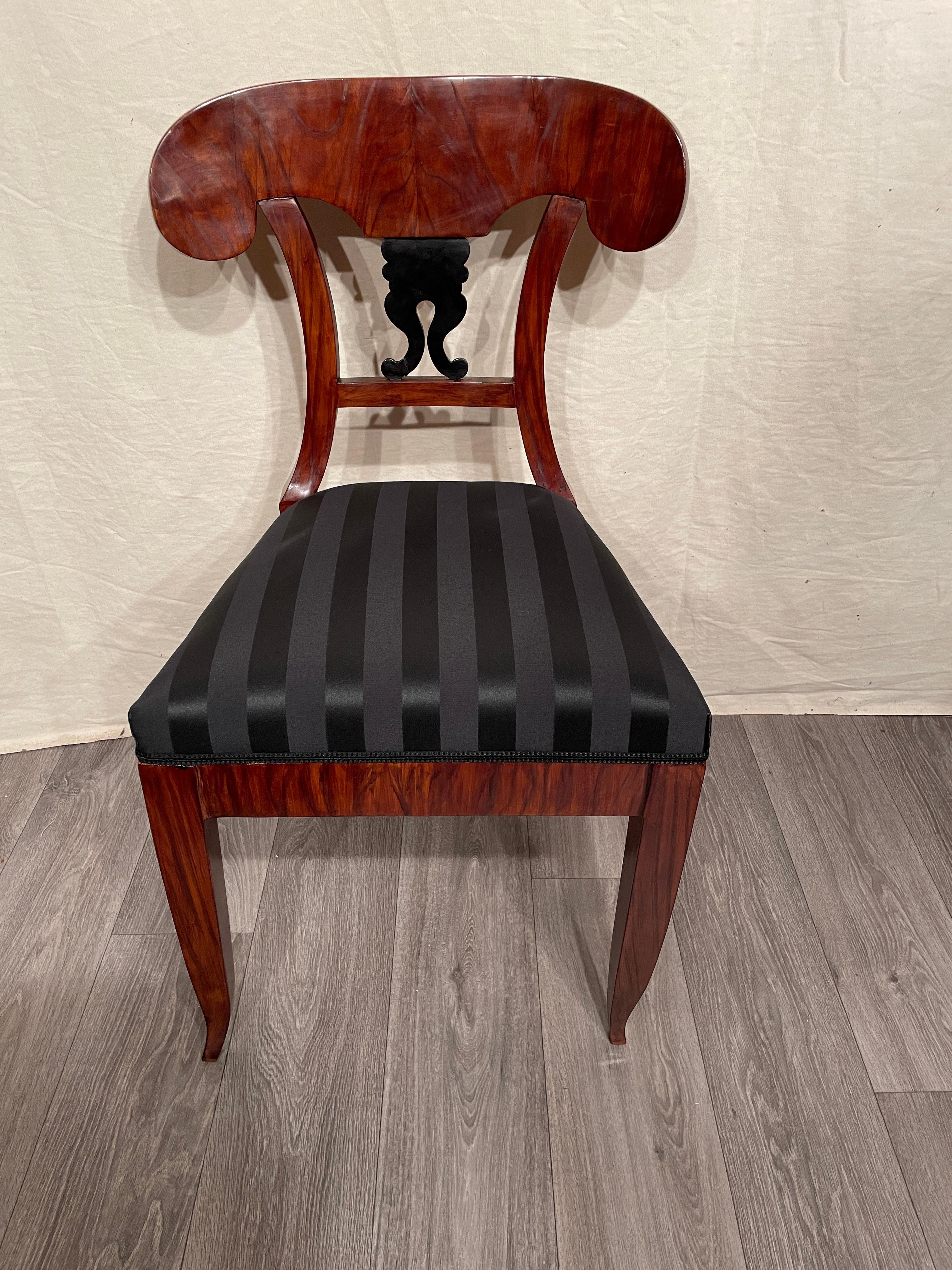 Biedermeier Chair, South German 1820. 
Beautiful walnut veneer embellishes this original Biedermeier chair. The back is decorated with an ebonized volute motif. The chair has been professionally refinished and shellack polished. It has new
