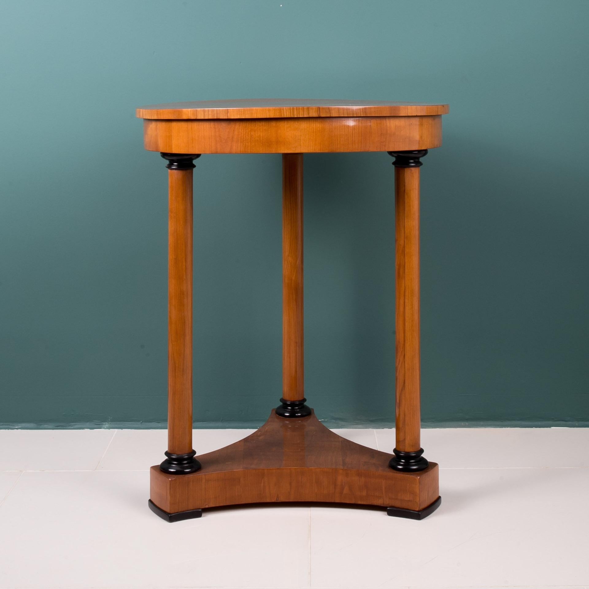 This beautiful Biedermeier table comes from Germany from early 19th century. It is supported on three slender legs that give it elegant and delicate look. The piece is after professional renovation process. Surface was finished with shellac polish,