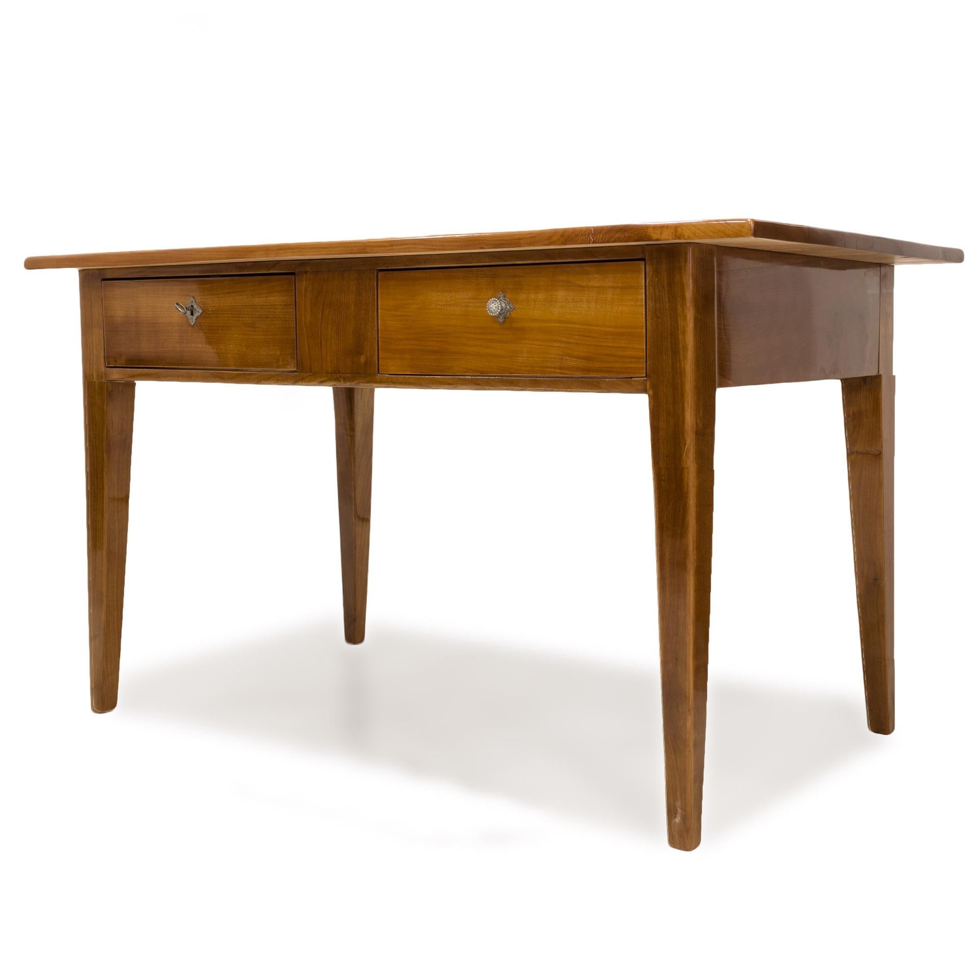 This beautiful Biedermeier table comes from Germany from 19th century. It is made of cherry wood. The piece is after complete renovation process - its frame has been finished with shellac polish, while the top has been protected with a durable