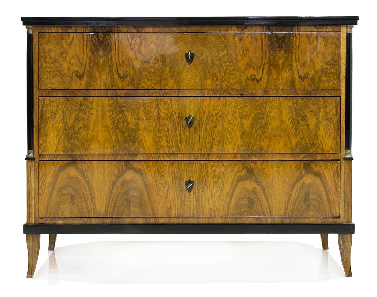 Beautiful, original three-drawer chest of drawers from the Biedermeier period. This piece was carefully restored, the structure was solidly reinforced and the drawers now slide with ease. It is made of spruce wood veneered with walnut with beautiful