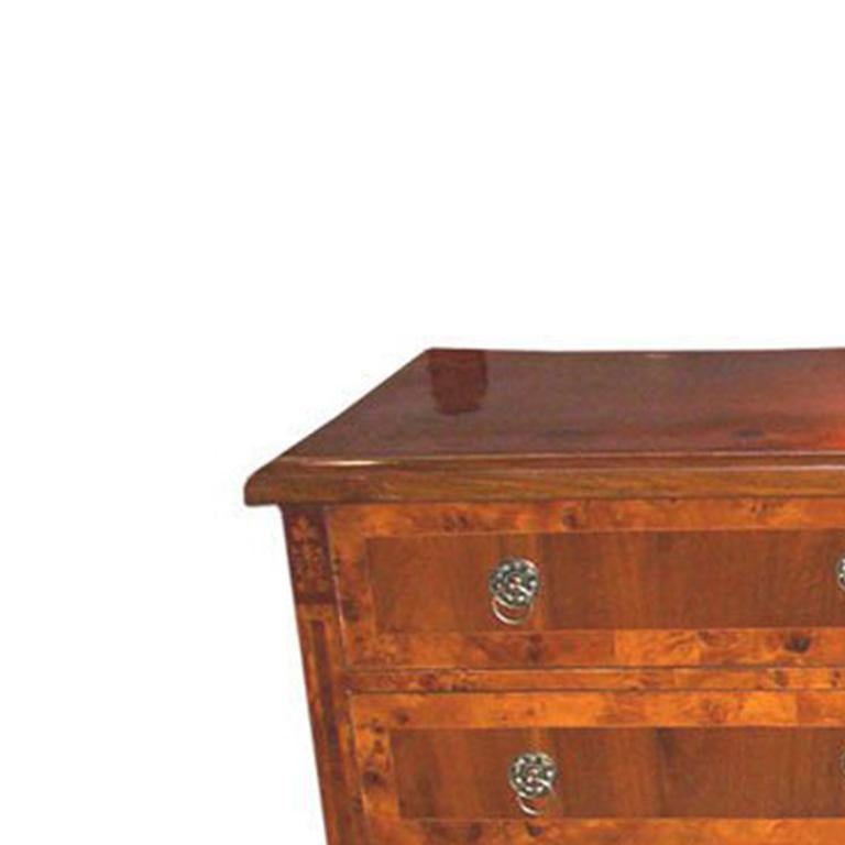 Biedermeier Commode in walnut, rootwood and ebony with 4 drawers.