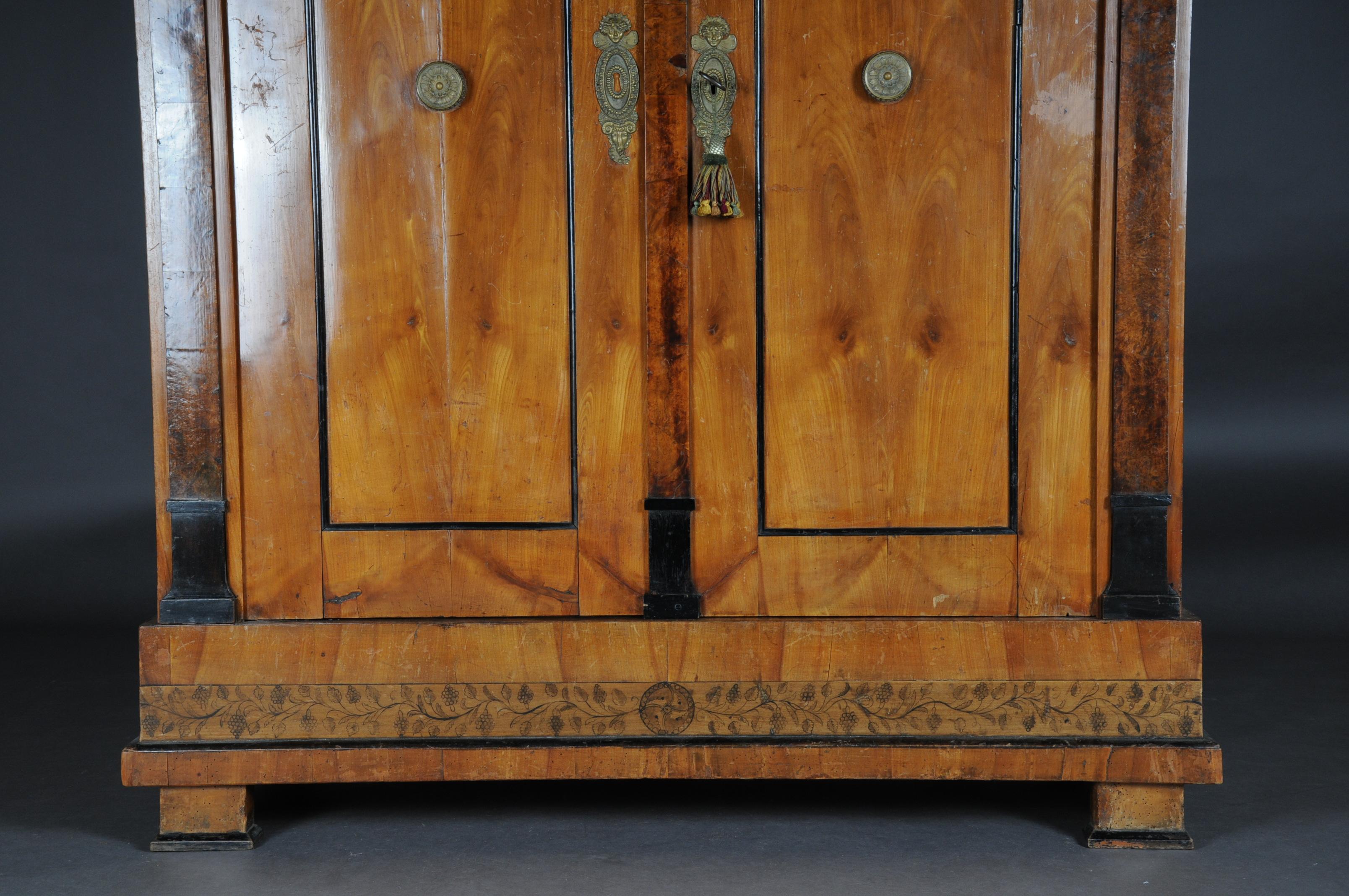 Impressive two-door plank cabinet, south German (Munich) solid cherry tree. Partial root wood and ebonized. Pyrography. Original key and lock available.


(O-249).