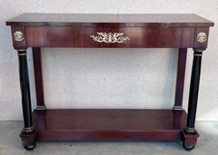 Console Biedermeier con colonne ebanizzate, supporti e cassetto in bronzo