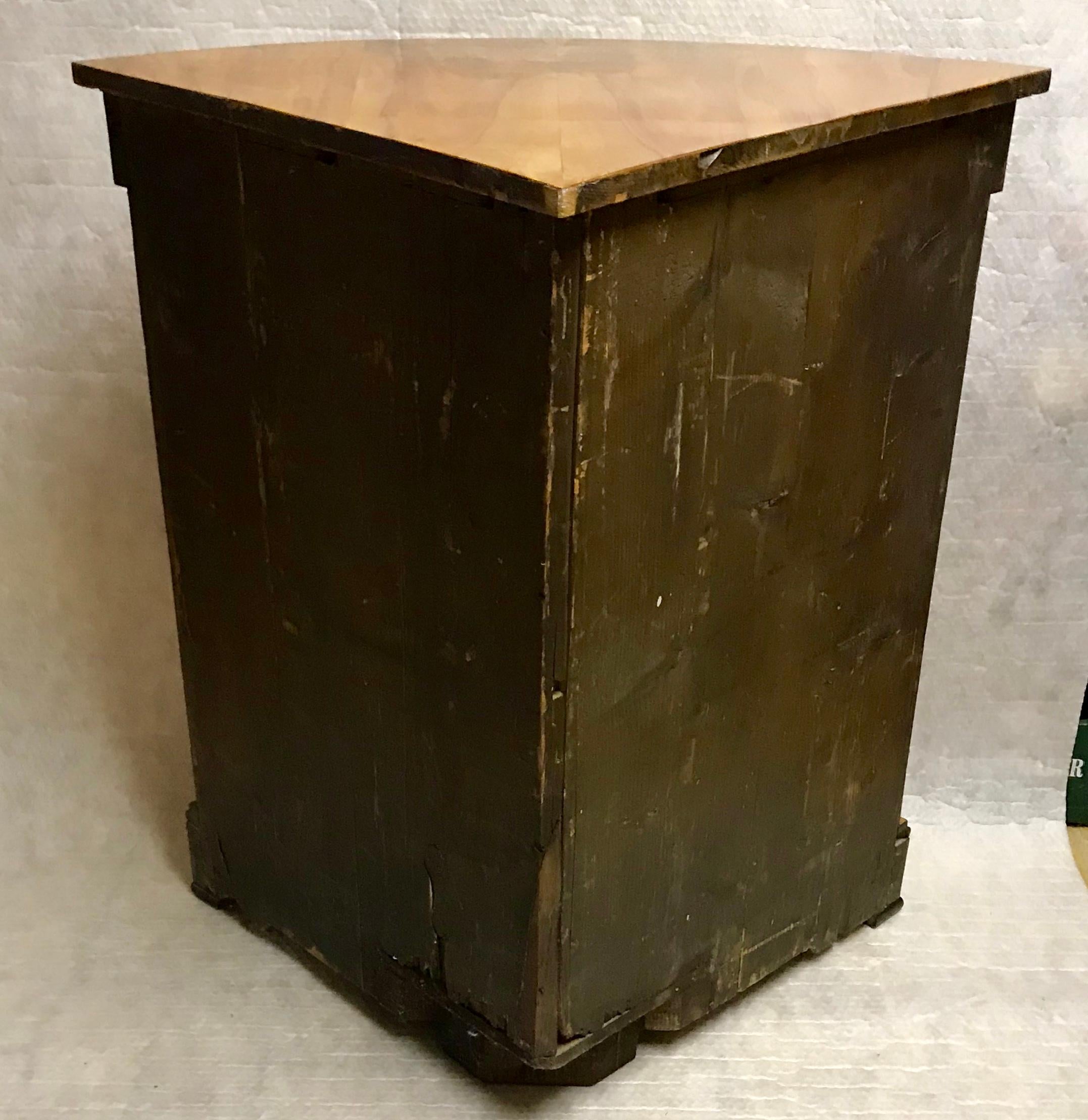 Biedermeier corner cabinet, Munich 1810-1820, cherrywood veneer with ebonized details, in very good condition with beautiful patina. The cabinet will be shipped from Germany, shipping costs to Boston are included.
