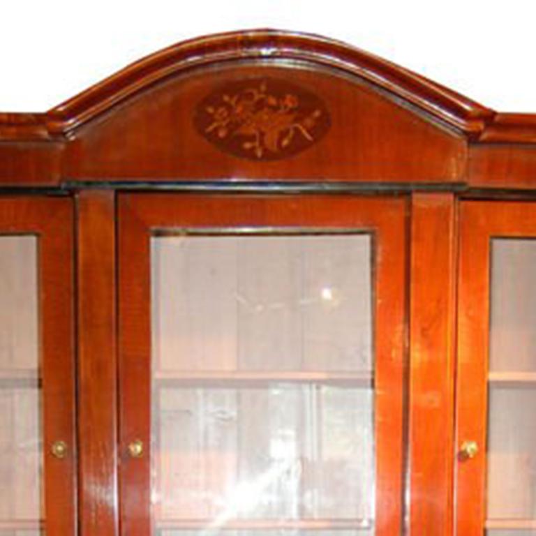 Biedermeier Credenza - oak wood, with inlaid cherry and marquetry. Three glass front doors with interior shelves above lower cabinet with two drawers and 2 doors with interior shelves.