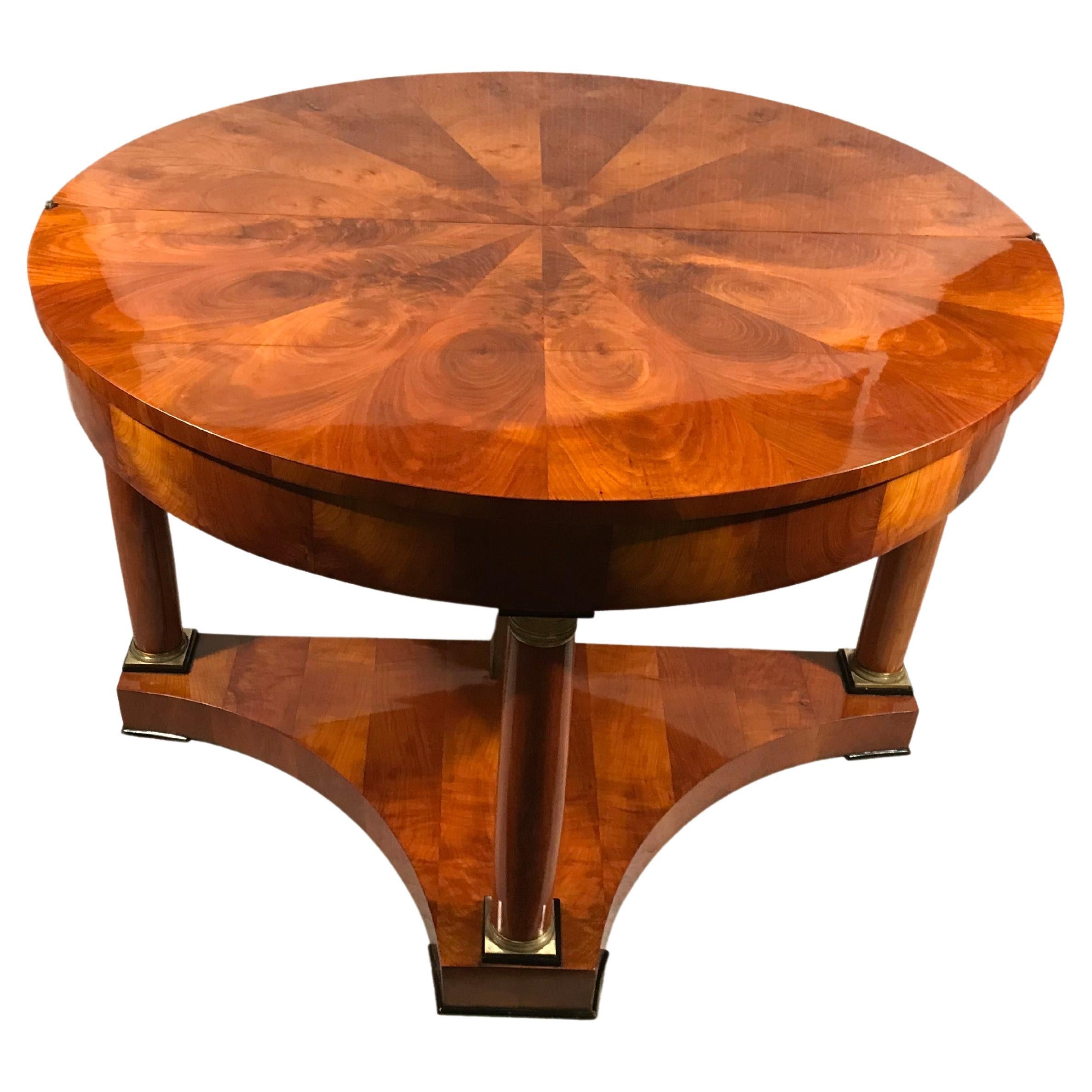 Biedermeier Demilune Table, 1815-20
Elevate your space with our exquisite Biedermeier demilune table, celebrated for its timeless elegance and distinctive design.

Standing on four column legs featuring brass capitals and bases, this table exudes
