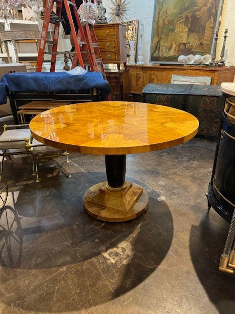 Biedermeier design bookmatched walnut veneer and black lacquer center table. This is a timeless classic!
