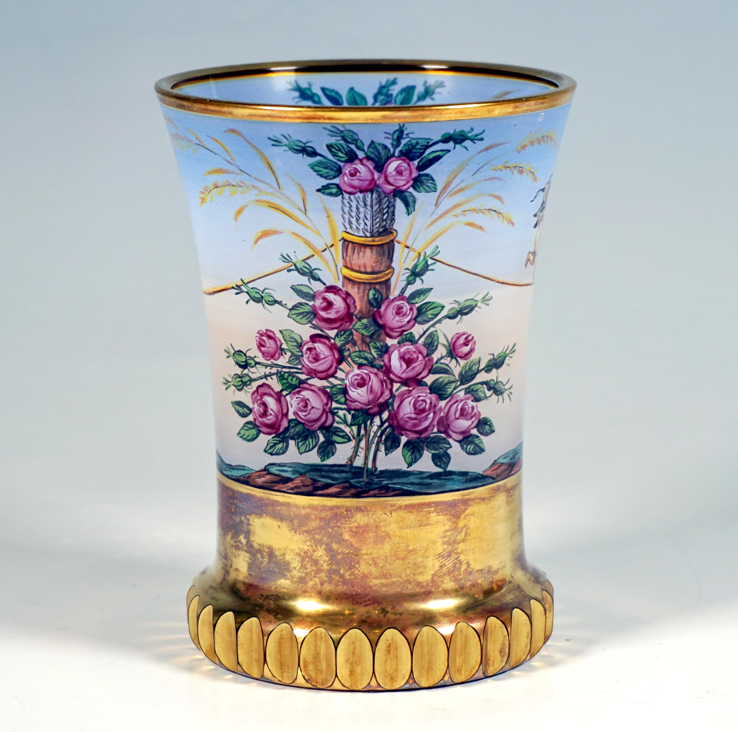 Colorless glass beaker with sweeping wall, with opaque painting 'en terrasse': surrounding depiction above a gilded base, here two rose bushes with ears of corn opposite each other, between them stretched ropes on which two putti are balancing with