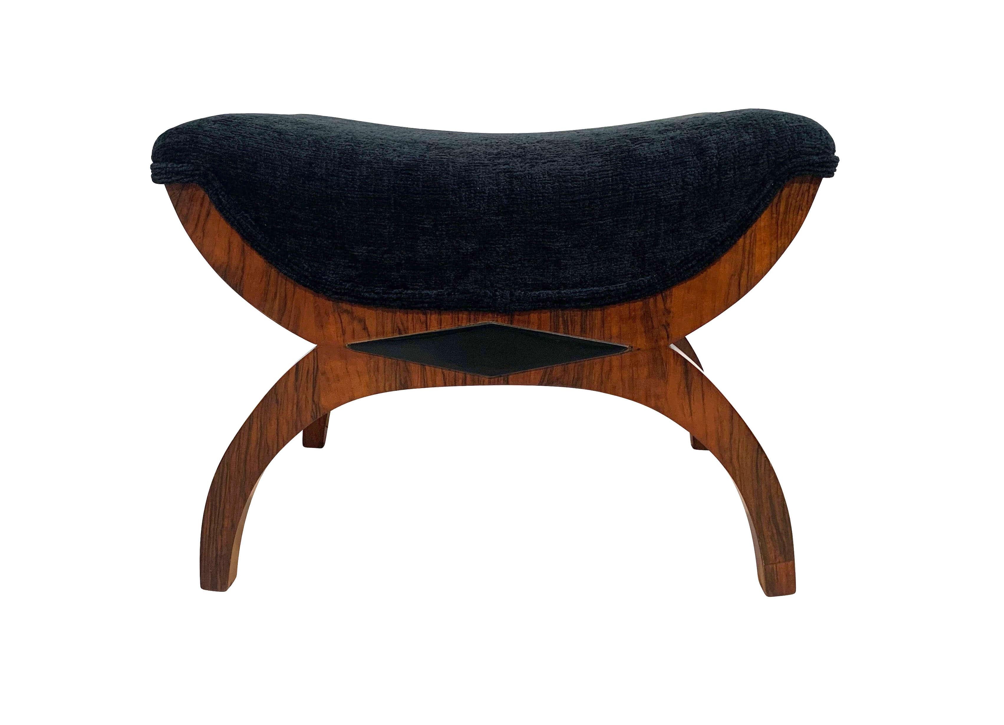 Elegant, classicist Gondola stool from the second period of Biedermeier, second half of the 19th century.

Wood: walnut solid and veneered, shellac hand-polished (French polished).

Newly upholstered with black mottled velvet fabric.
