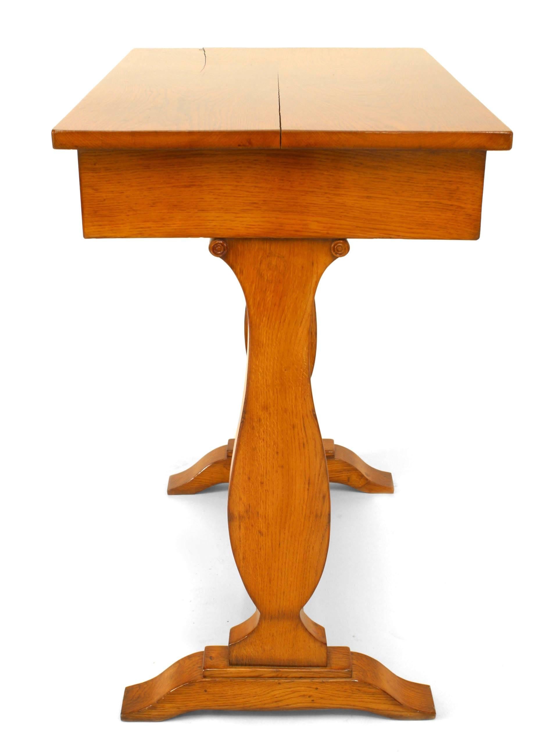 Biedermeier (Hungarian) (19th-20th century) elmwood end table with double pedestal base connected with a stretcher and a drawer.
 