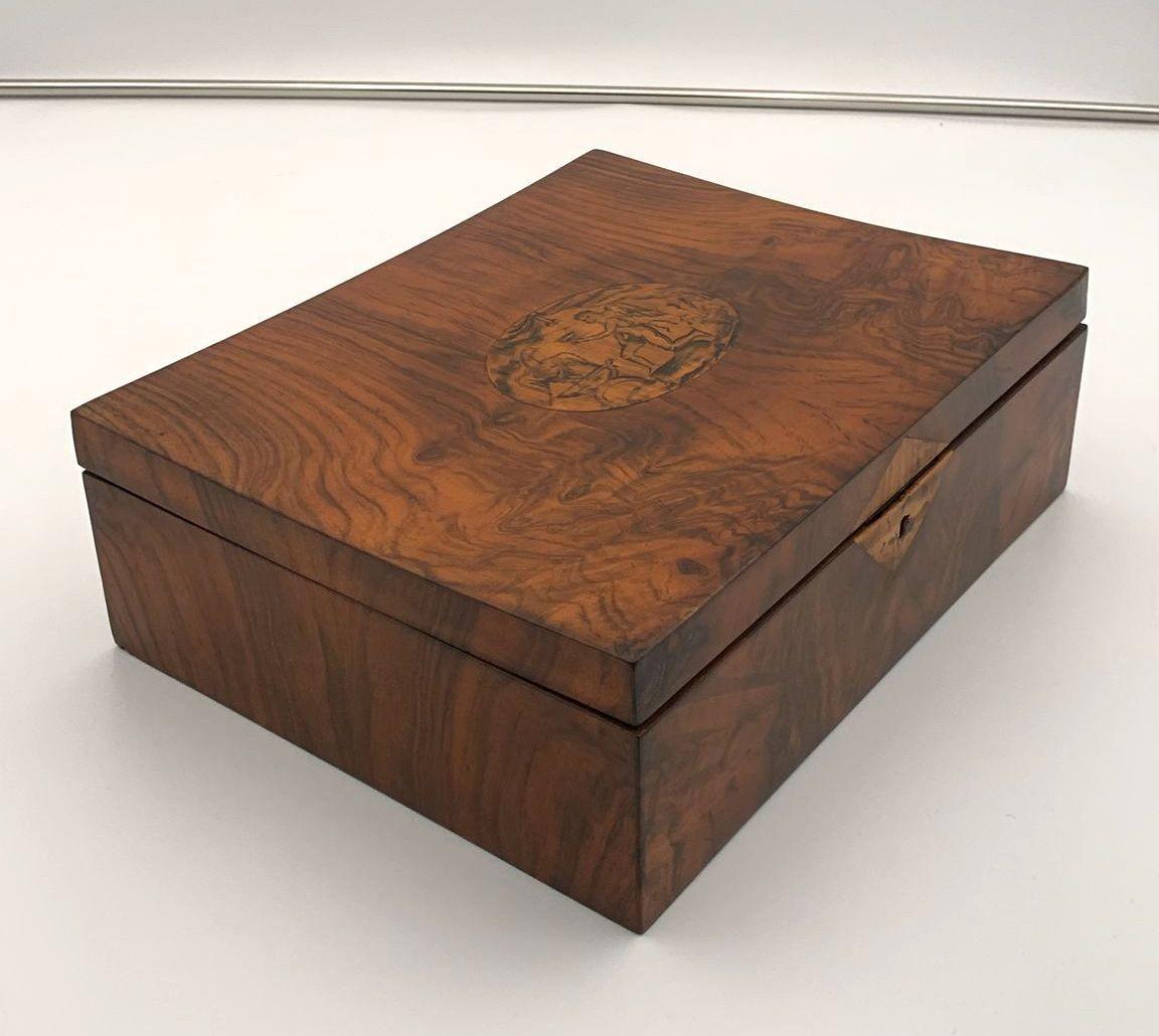 Rare Biedermeier Jewelry Box, Walnut Veneer, Ink painting, Austria circa 1820
Walnut and maple veneered on hardwood.
Original old Ink painting on maple (Winged Cupid with chalice and bird).
Inside with original red paint and 4 small drawers with