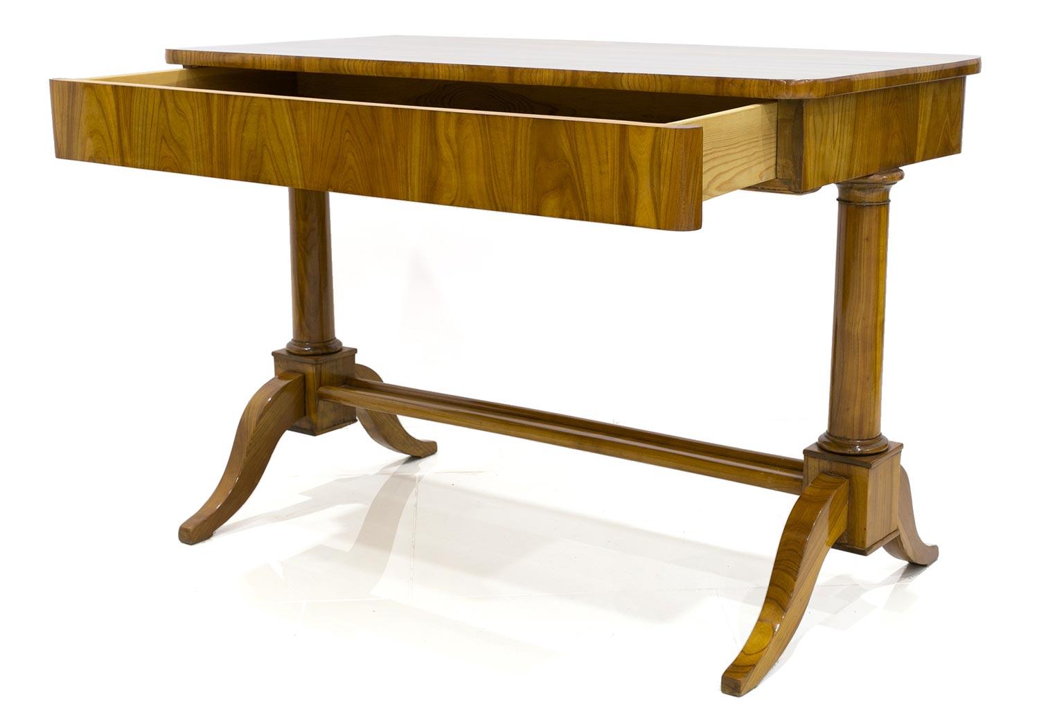 This Biedermeier lady desk comes from Germany from circa 1830. It features one spacious practical drawer and a comfortable footrest. The piece was fully renovated polished to high gloss.
