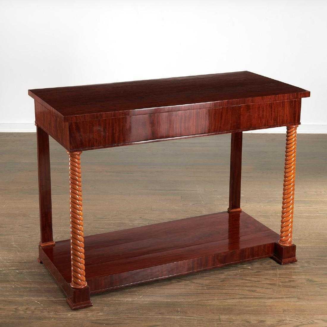 Biedermeier mahogany and fruitwood console or pier table of elegant proportions having a rectangular mahogany top resting on 2 front cord-shaped blond fruitwood columns. Inscribed in ink “E-1879”.
 