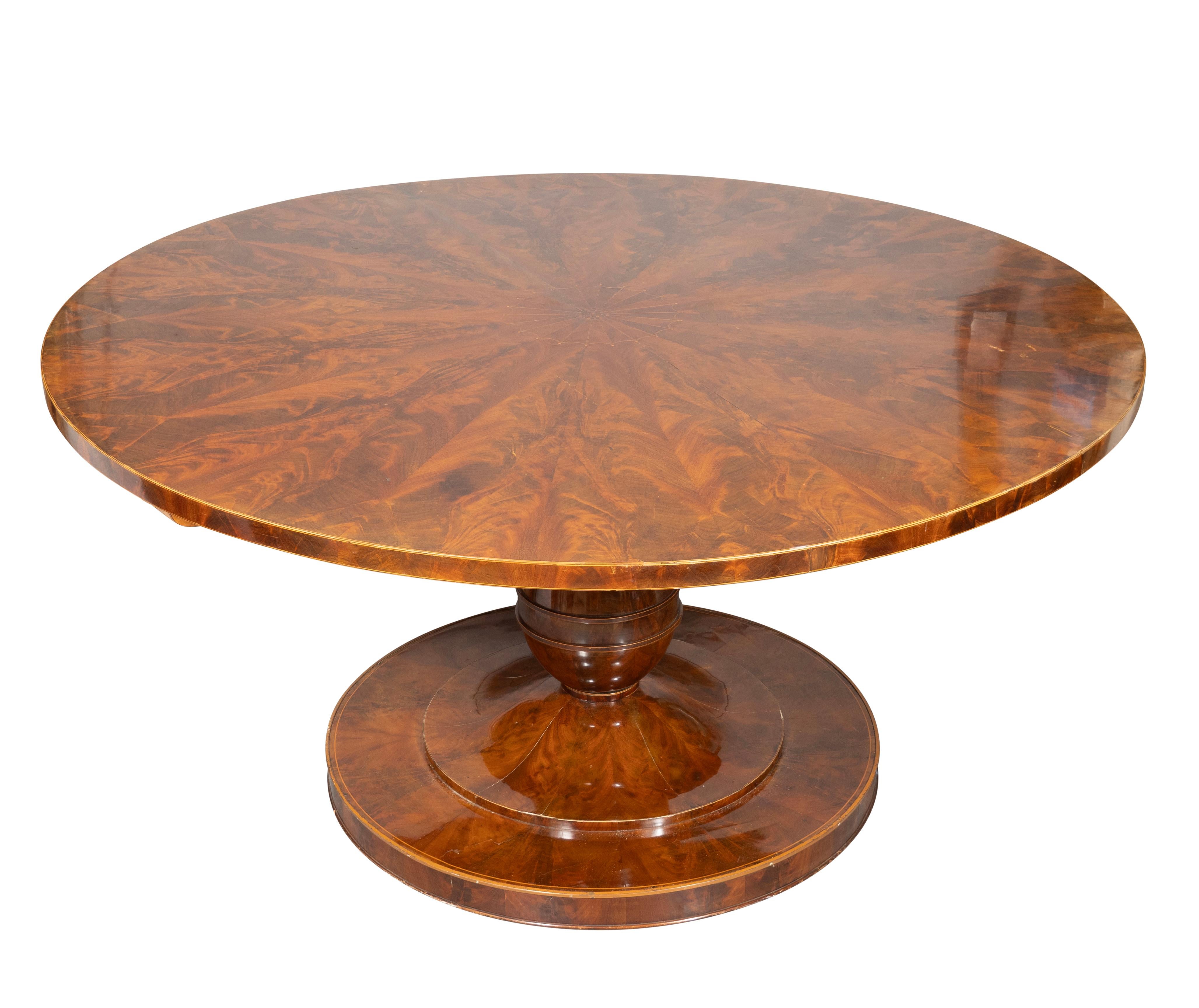 Circular hinged top with pie wedge veneers and inner satinwood fan inlaid ring. Baluster form support and circular base. A quality piece of Viennese furniture with unusually large diameter top.