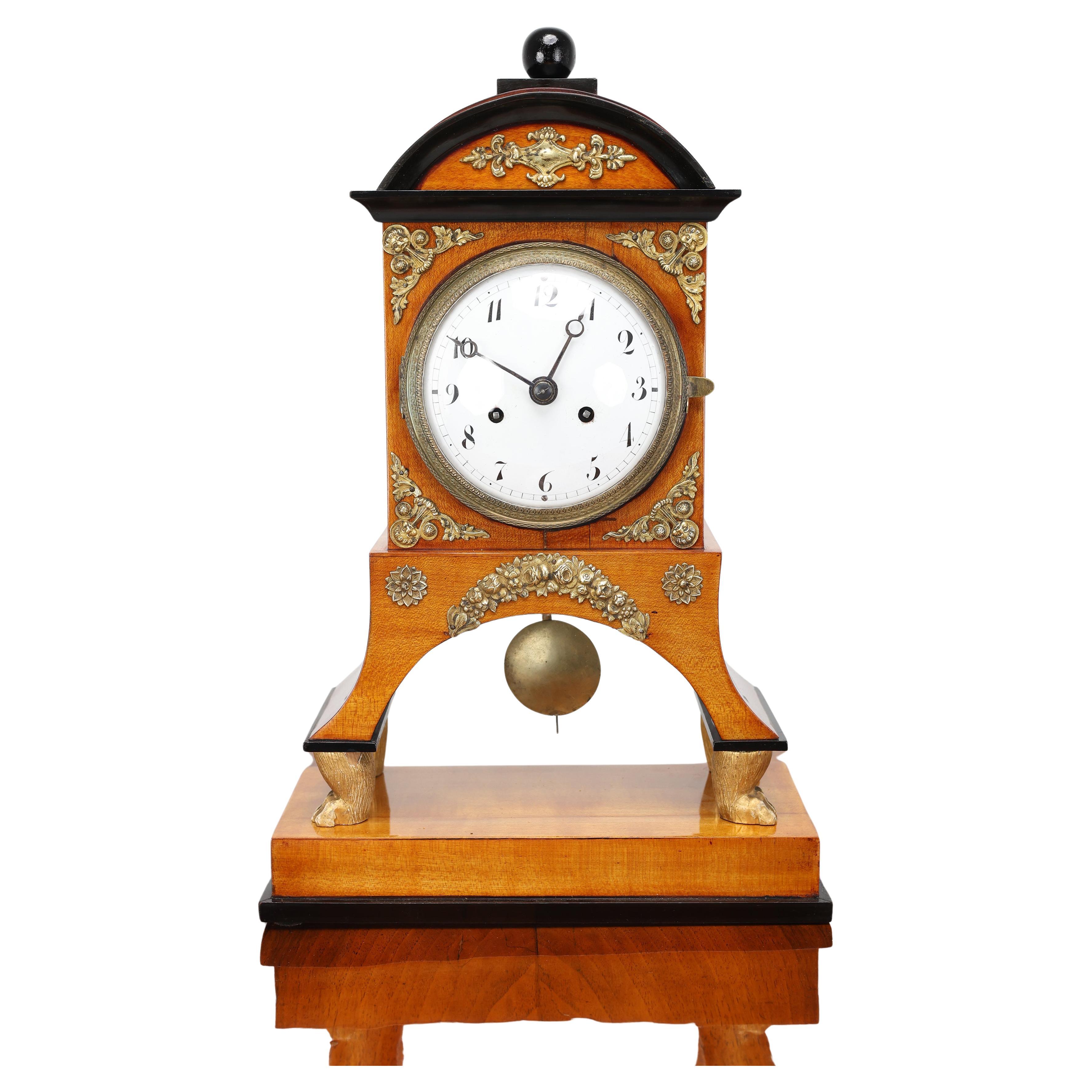Biedermeier Mantel Clock, Early 19th Century

A sophisticated Biedermeier mantel clock, crafted in Austria circa 1810–1830. This exceptional piece combines timeless elegance with outstanding craftsmanship, making it a perfect addition to traditional