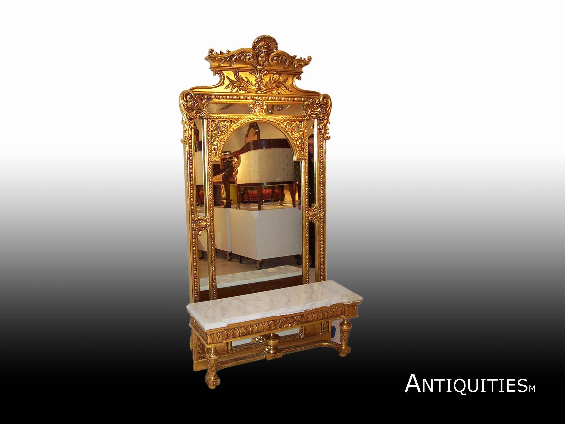 Gilded with 22-karat gold leaf with base and marble top.

Measures: Mirror 83.5