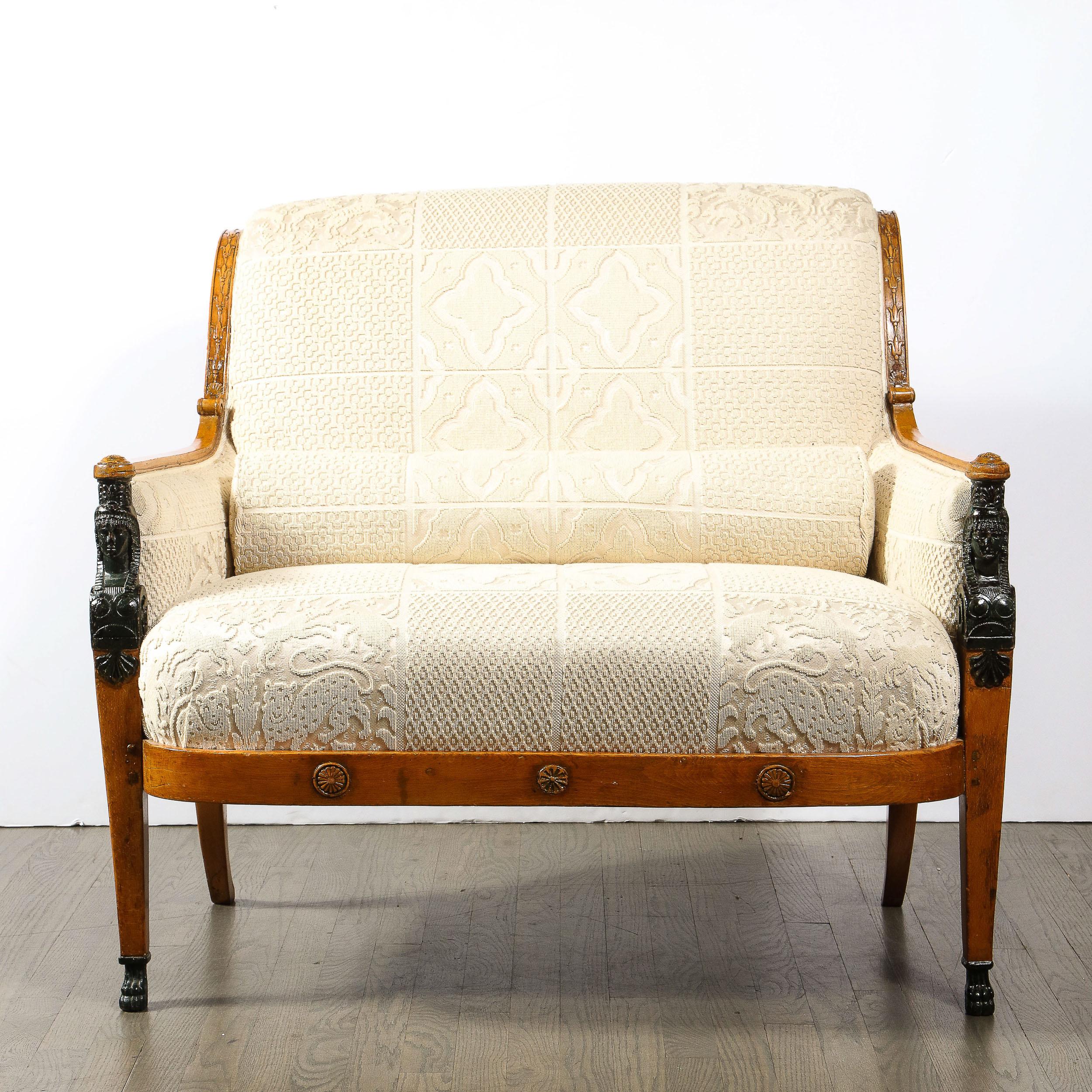 This stunningly formed Biedermeier Settee with Scroll Form Back & Saber Supports in Beachwood with Neoclassical Detailing originates from France, Circa 1840. Features a beautifully reserved geometric composition adorned with subtle carved detailing
