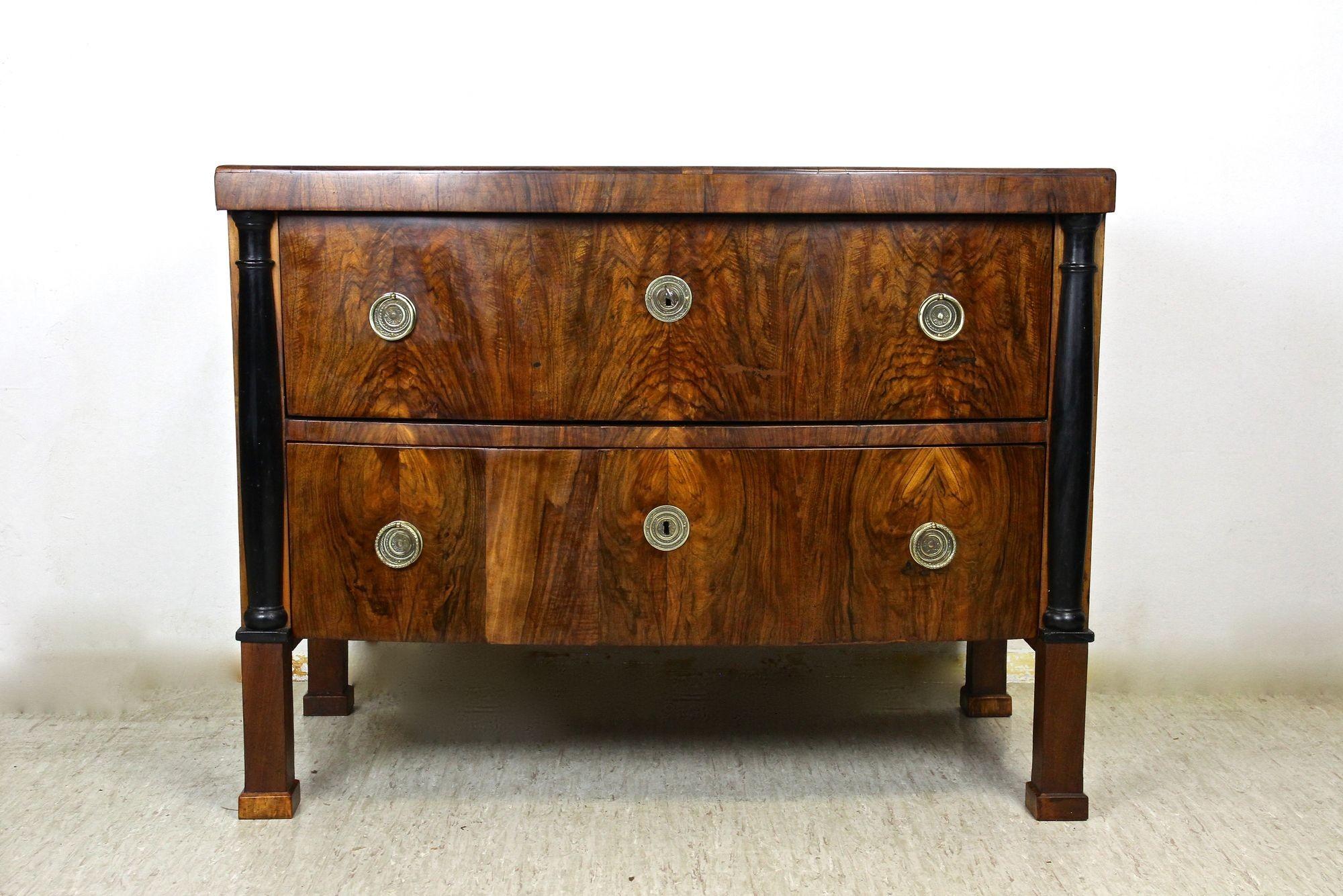 Exceptional Biedermeier nutwood chest of drawers from the early 19th Century in Austria. An eye-catching two-drawer commode from the famous Biedermeier period in Vienna around 1825 which holds the still original, fully functional locks. Veneered
