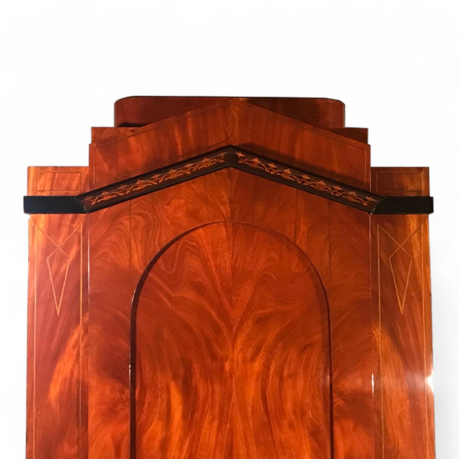 Biedermeier One-Door Wardrobe, Berlin 1815-20
This elegant Biedermeier one-door wardrobe is a fine example of timeless craftsmanship, featuring a mahogany veneer accented with intricate details. The upper section showcases an ebonized inlay band