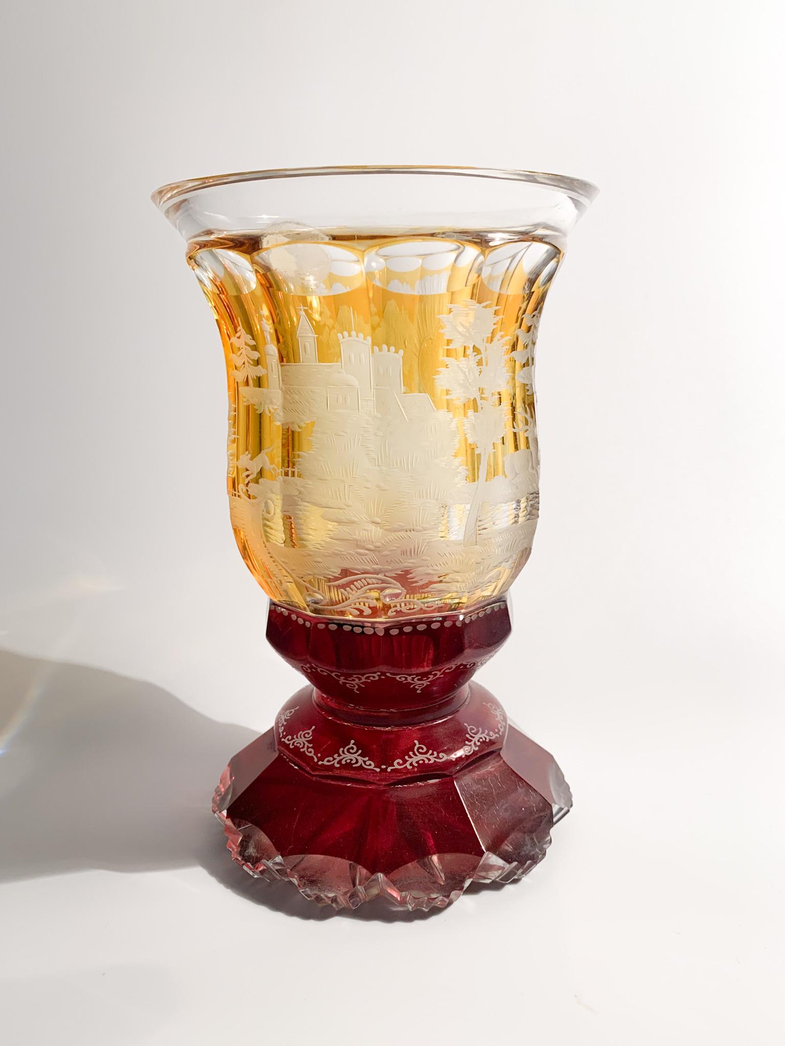Glass in orange and red Biedermeier crystal, decorated with acid and made in 1800

Measures: Ø cm 10 H cm 16

Biedermeier is was an artistic movement that developed between 1815 and 1848. The term initially spread as a pejorative. Composed of