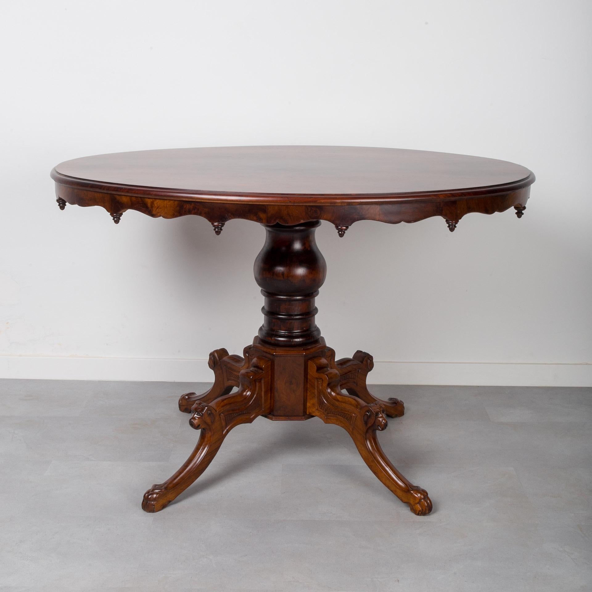 This Biedermeier oval table was made in Germany in 19th Century. It is supported on a solid walnut leg, the top is veneered with walnut. The piece has undergone a careful renovation process and is finished with semi-matte lacquer that not only gives