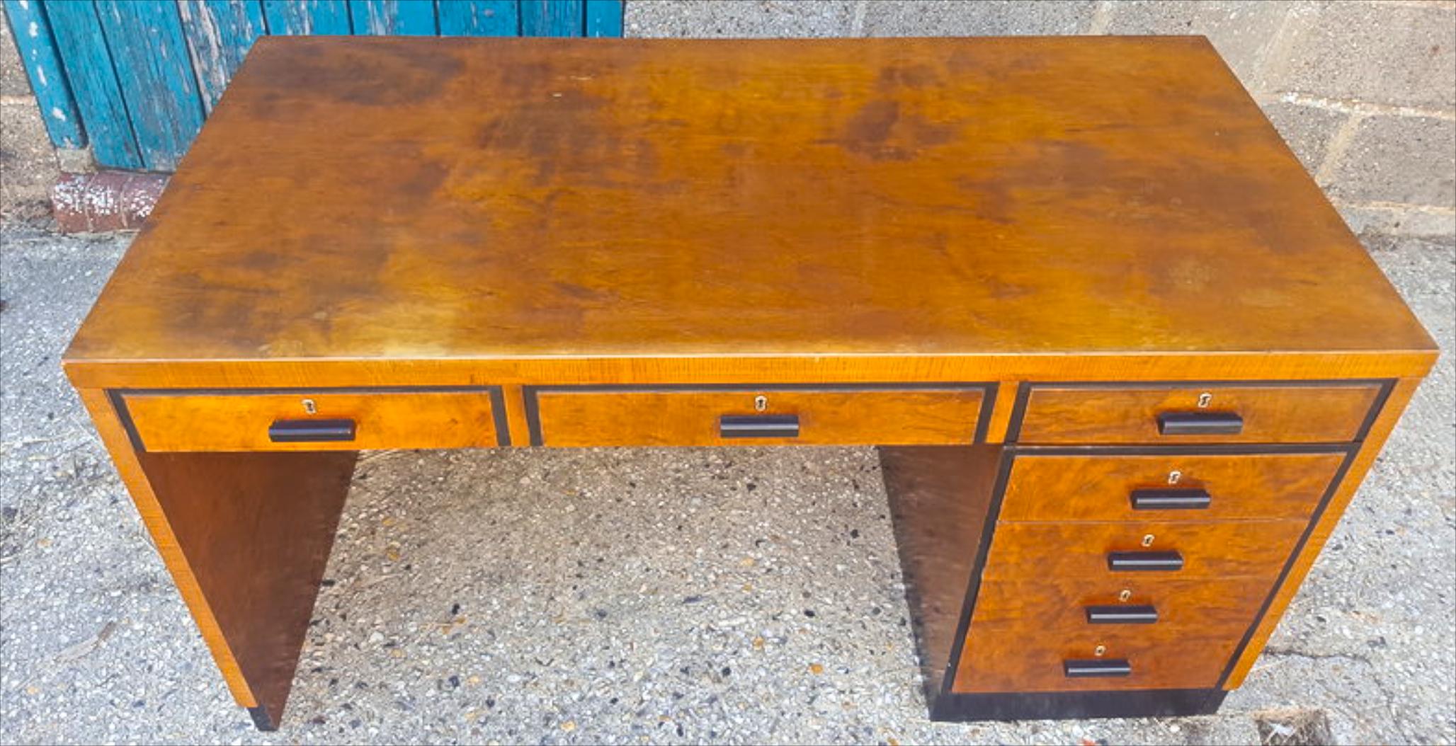 Unusual partners desk in the Biedermeier style from the early 20th Century.

It has three drawers in the main desk and ormolu style detail on the drawer edges and handles. 

The stack of four drawers is actually moveable so you can have it on either