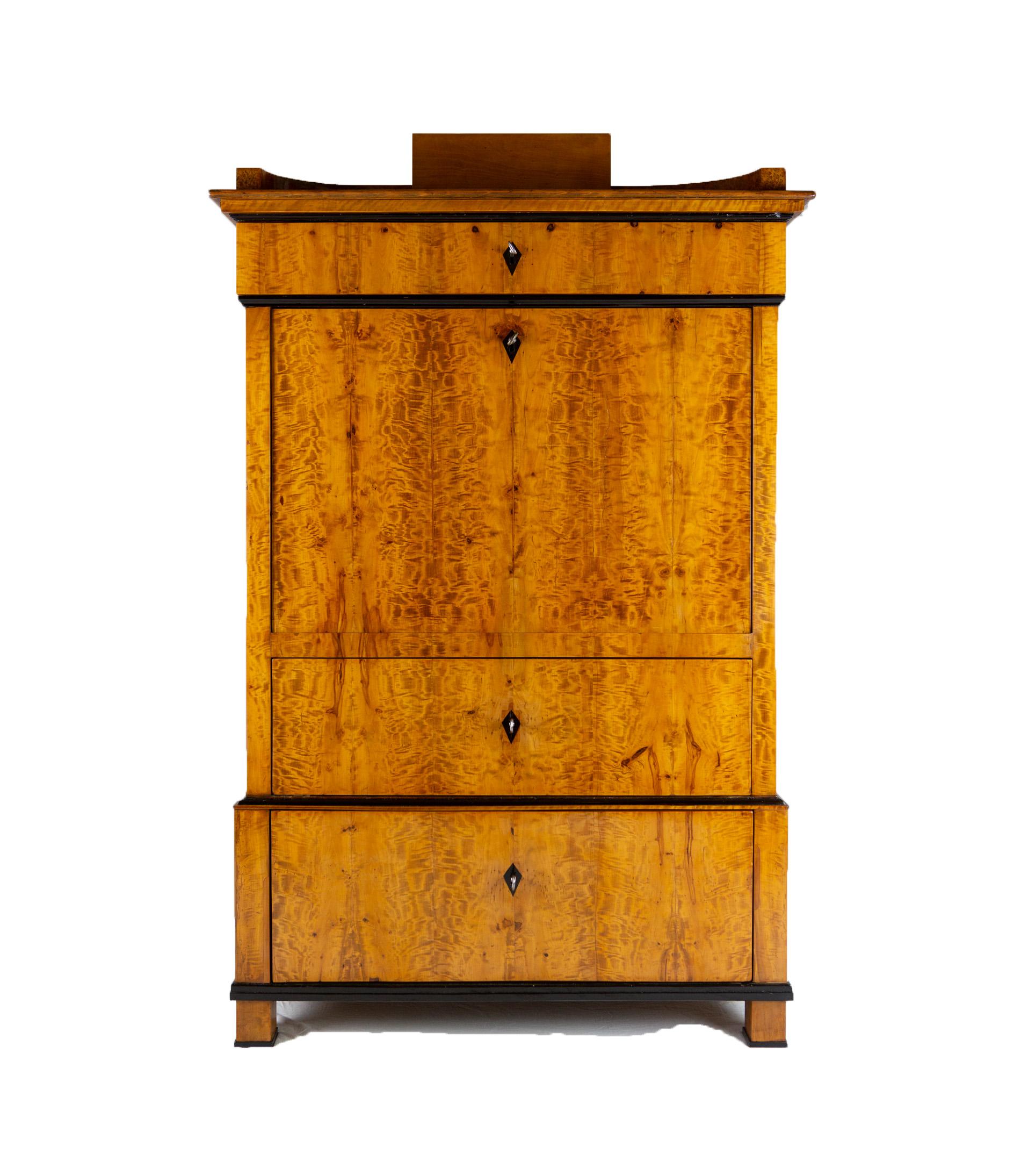 Exceptional 19th century Biedermeier period secretary in birchwood veneer, circa 1830-1840 from Northern Germany. The secretary has two spacious drawers on the bottom and one drawer at the top. This piece is ready for residential use and in restored