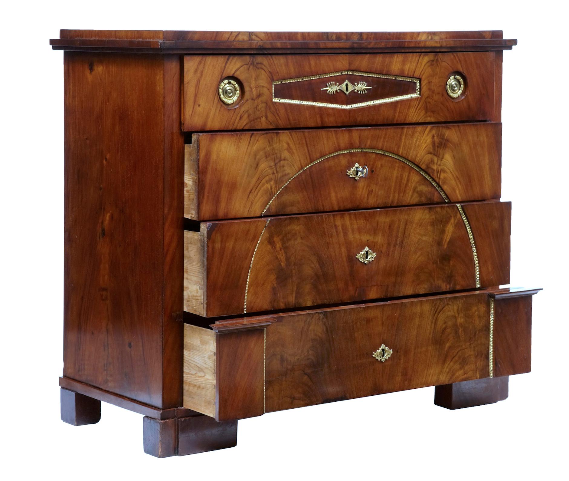 Biedermeier period Swedish mahogany secretaire chest of drawers, circa 1810.

Stunning secretaire chest in rich mahogany. 4 drawer chest with architectural elements to the bottom drawer.

Top drawer pulls out and lowers to create a small writing
