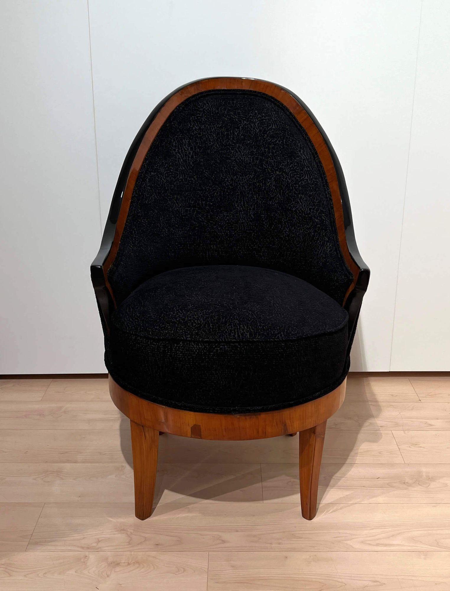Rare original Biedermeier swivel or revolving chair or bergere chair, armchair or club chair from South Germany about 1820.
 
Cherry veneered and solid. Newly upholstered with black mottled velvet fabric and double keder.
Base on 4 legs with