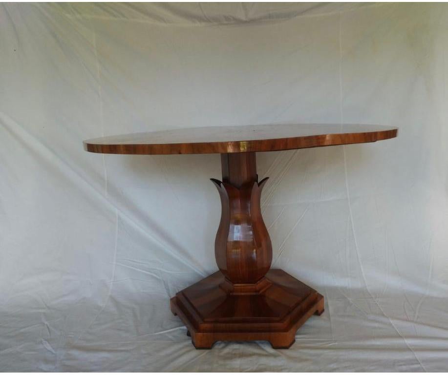 Biedermeier period
Round table with one carved corolla center pedestal
Base hexagonal
Cross cut fruitwood bookmatched
Impeccable condition.